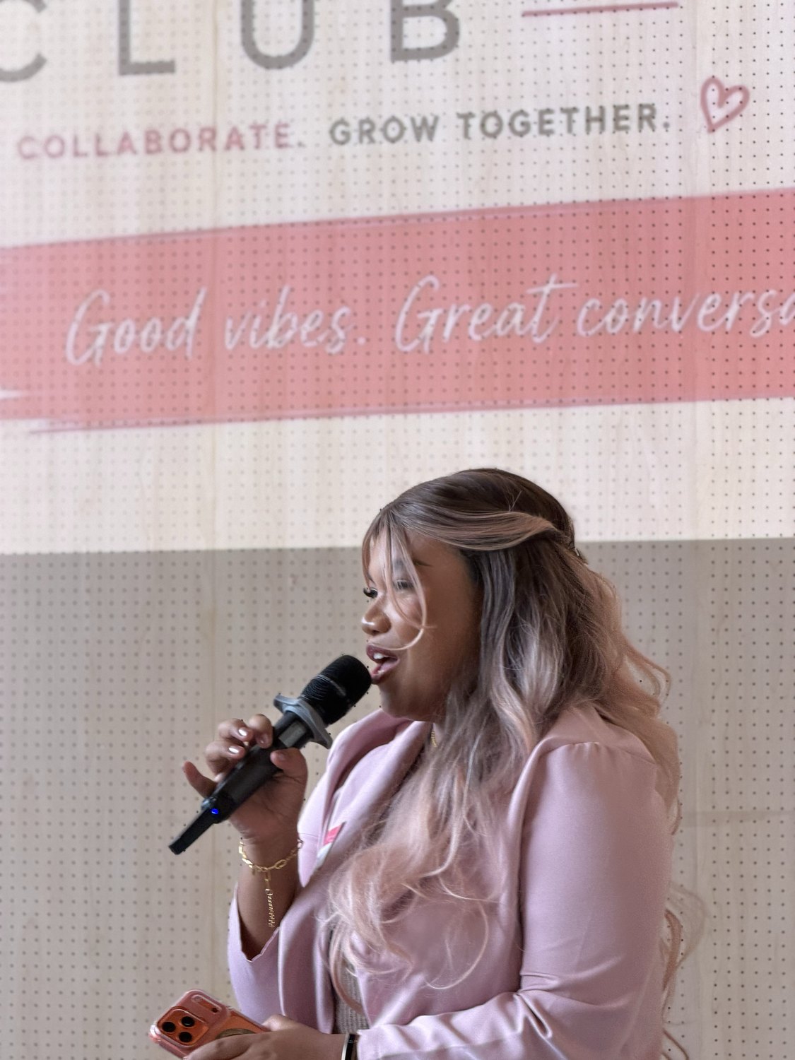 A guest speaking into the microphone