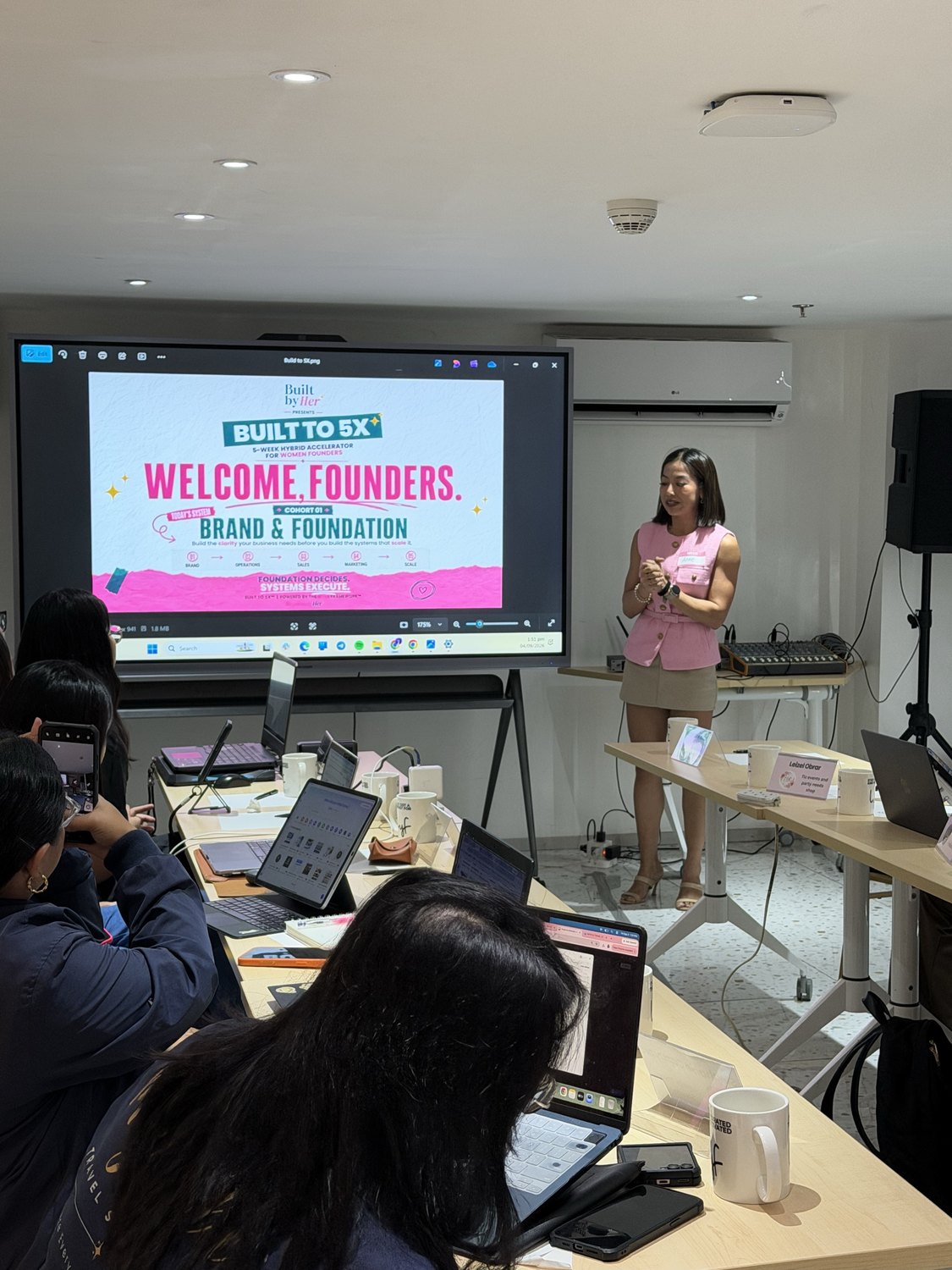 The room during the welcome, founders at their laptops