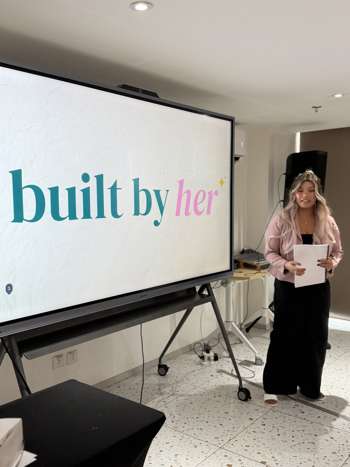 A facilitator opening the Built by Her brand session