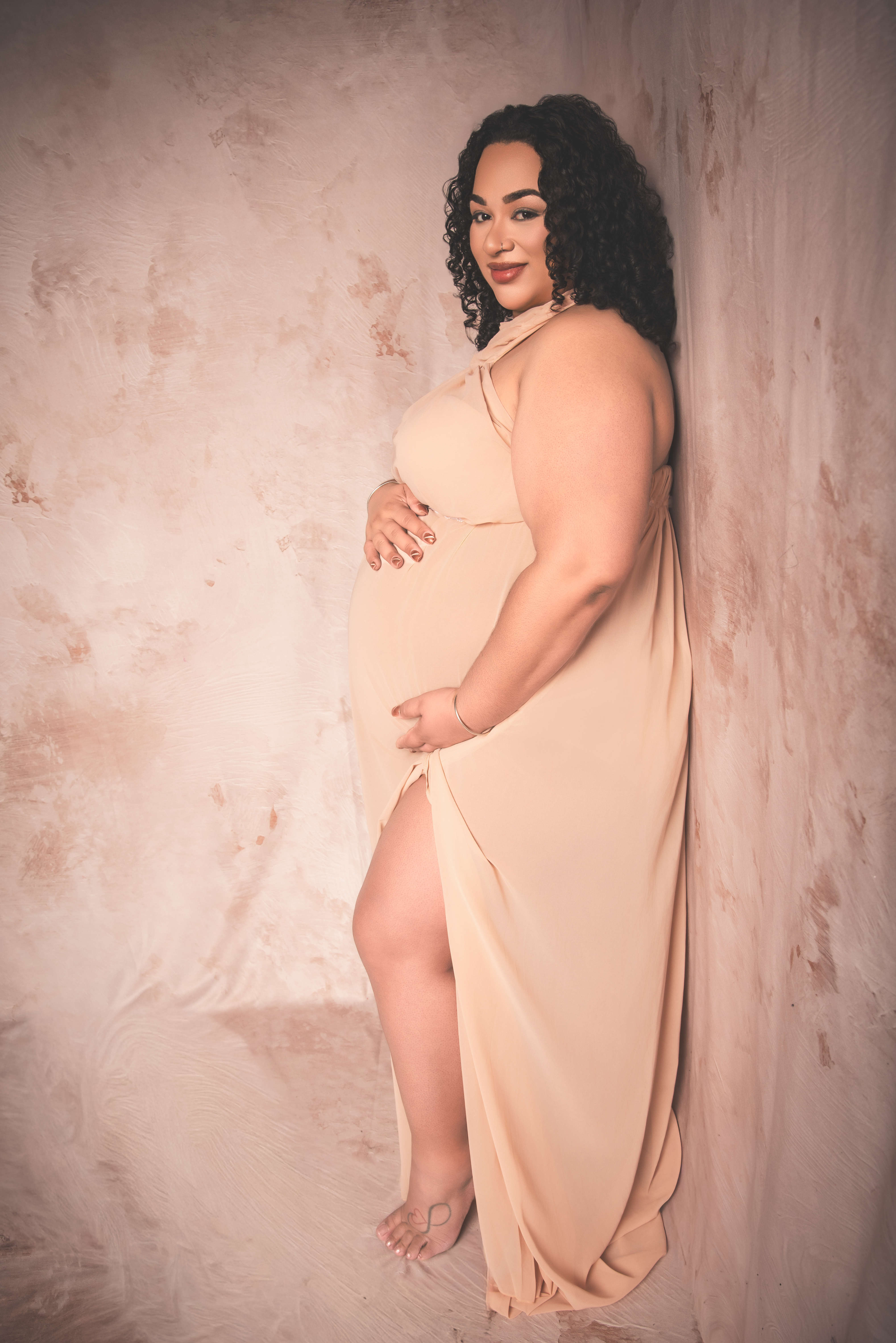 Artistic Maternity photo of woman wearing a gown for maternity photos  in Atlanta