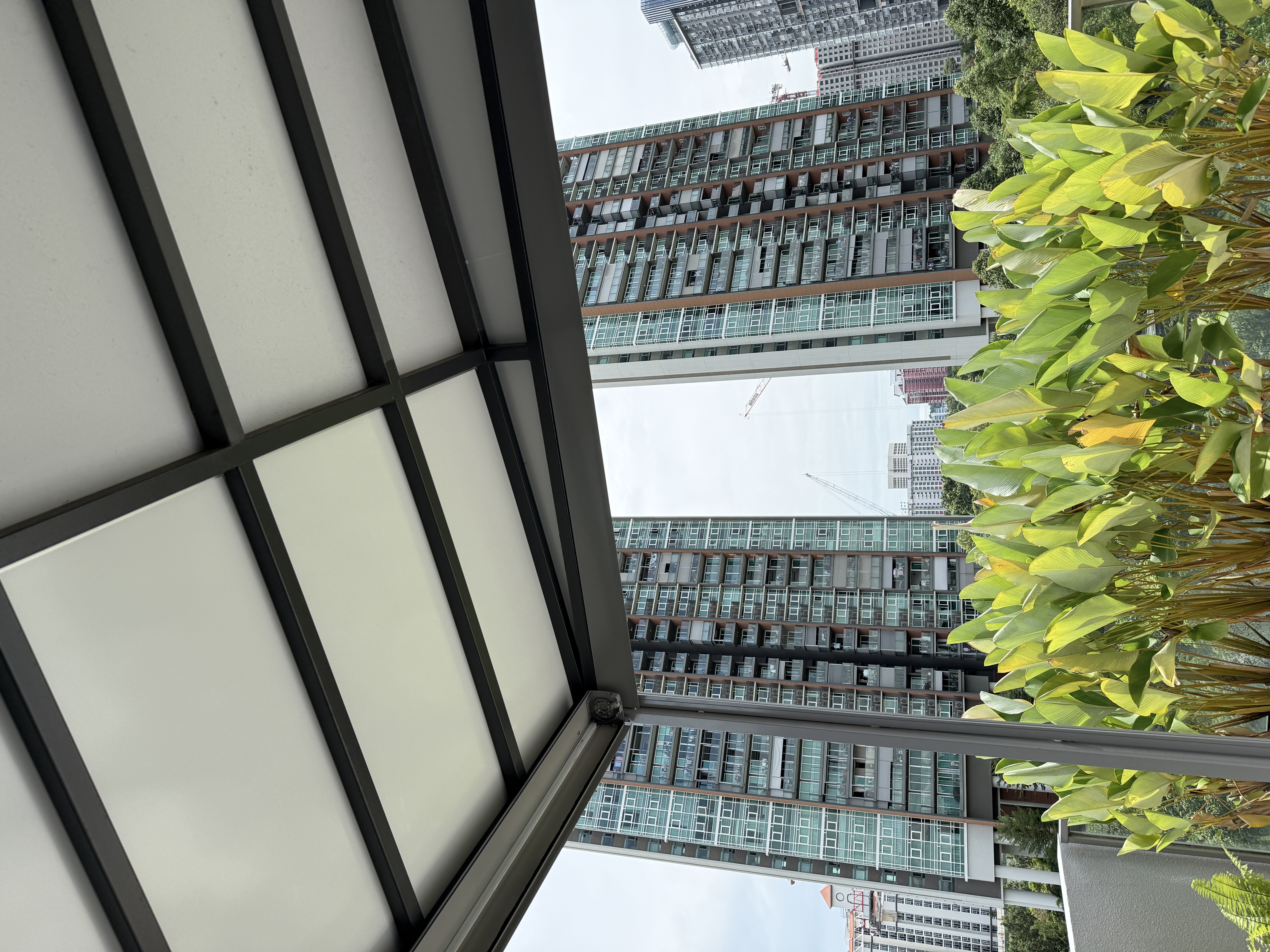 ACP roofing system creating a cooler covered outdoor area in Singapore