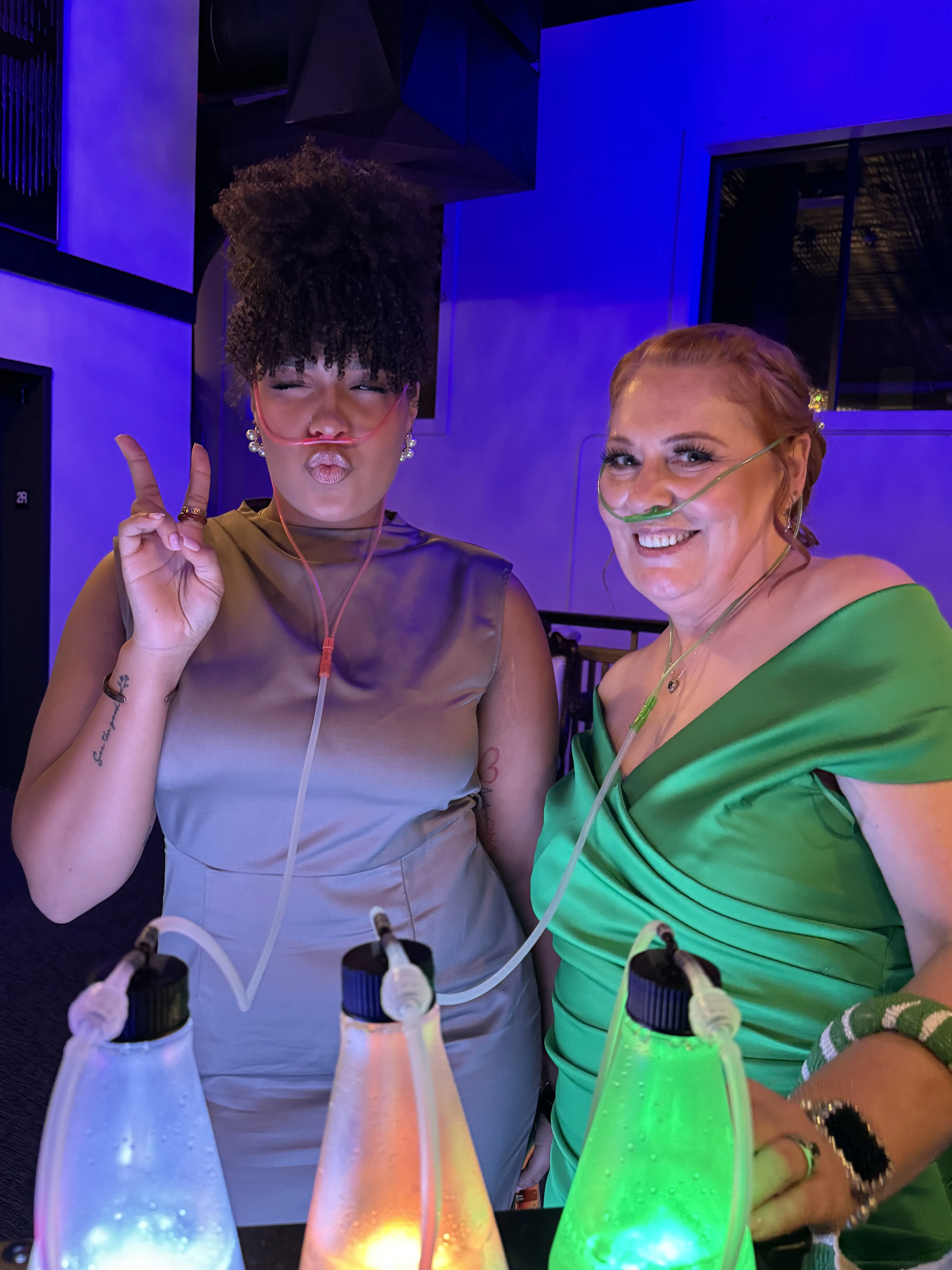 OxygenBar360 LED oxygen bar station at an evening event