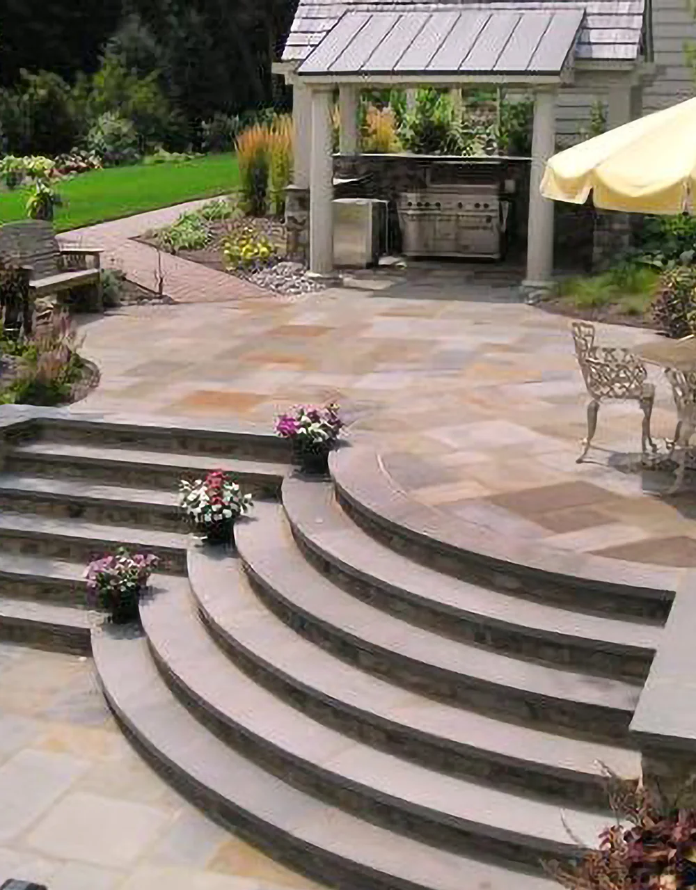 A hardscape patio and retaining wall from Bollman Landscape A hardscape patio and retaining wall from Bollman Landscape