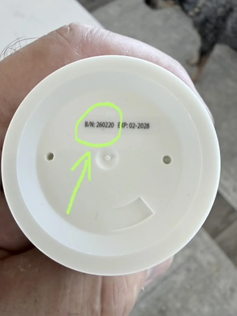 Batch number B/N 260220 circled on the bottom of a LactiGo bottle