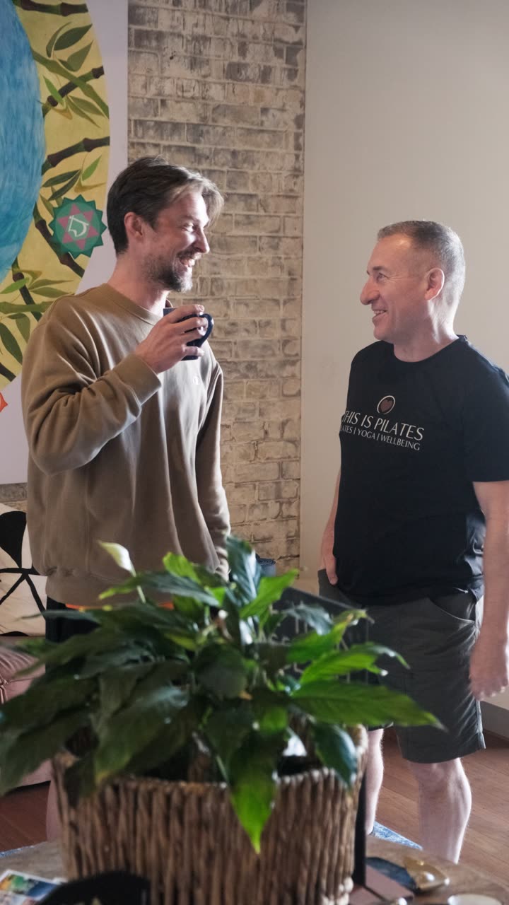 Keith Flowers talking with a guest at a This Is Yoga open day