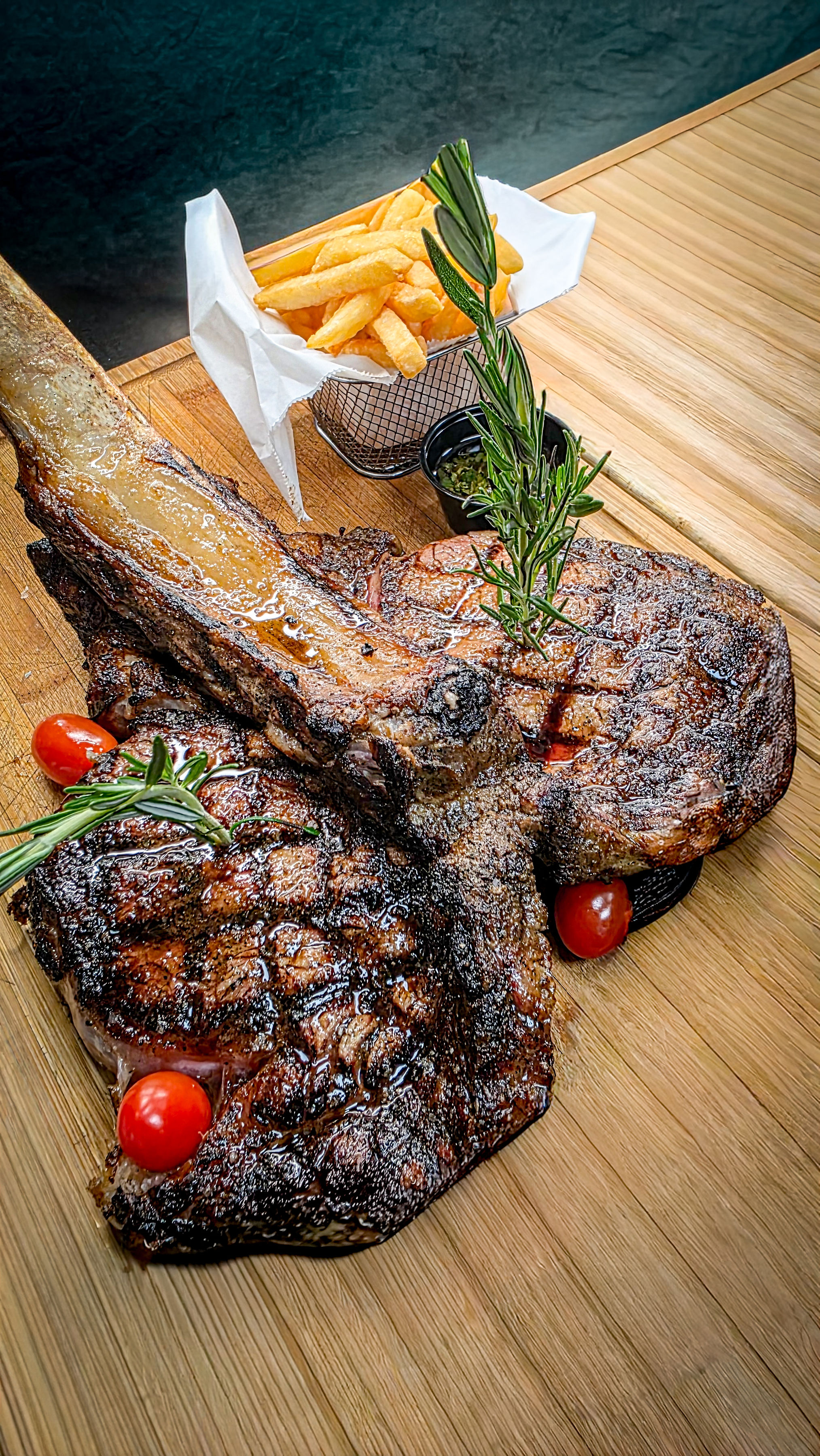 Steak off the wood-and-charcoal grill at Cow Steakhouse, Kissimmee