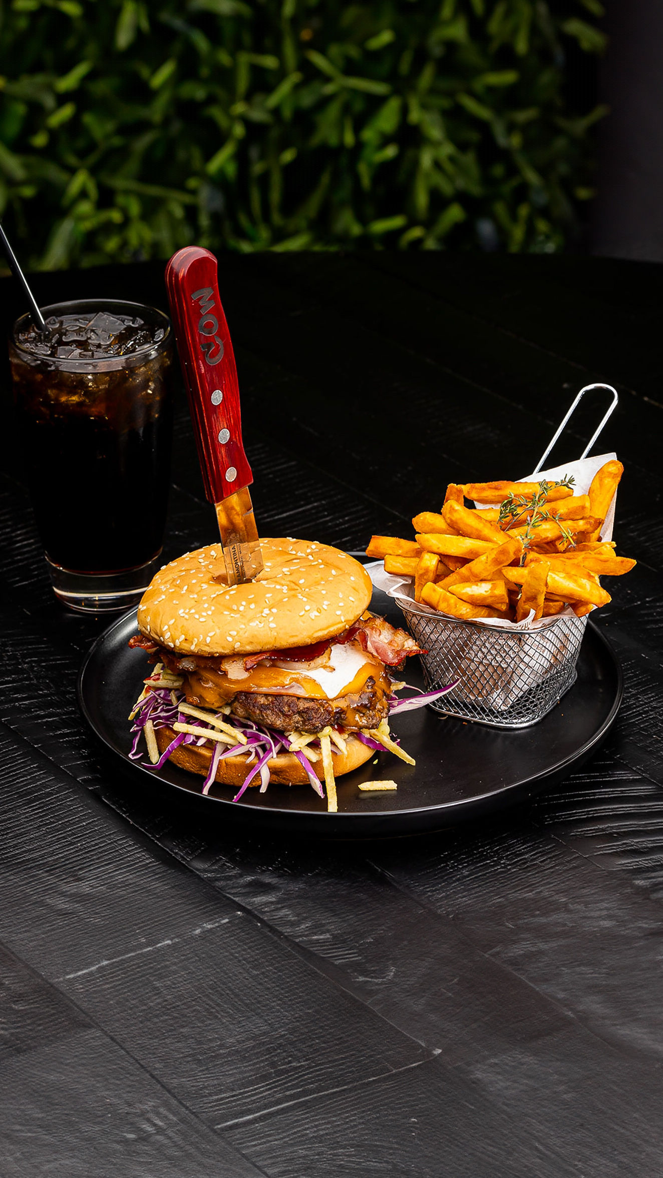 Loaded burger with fries at Cow Steakhouse