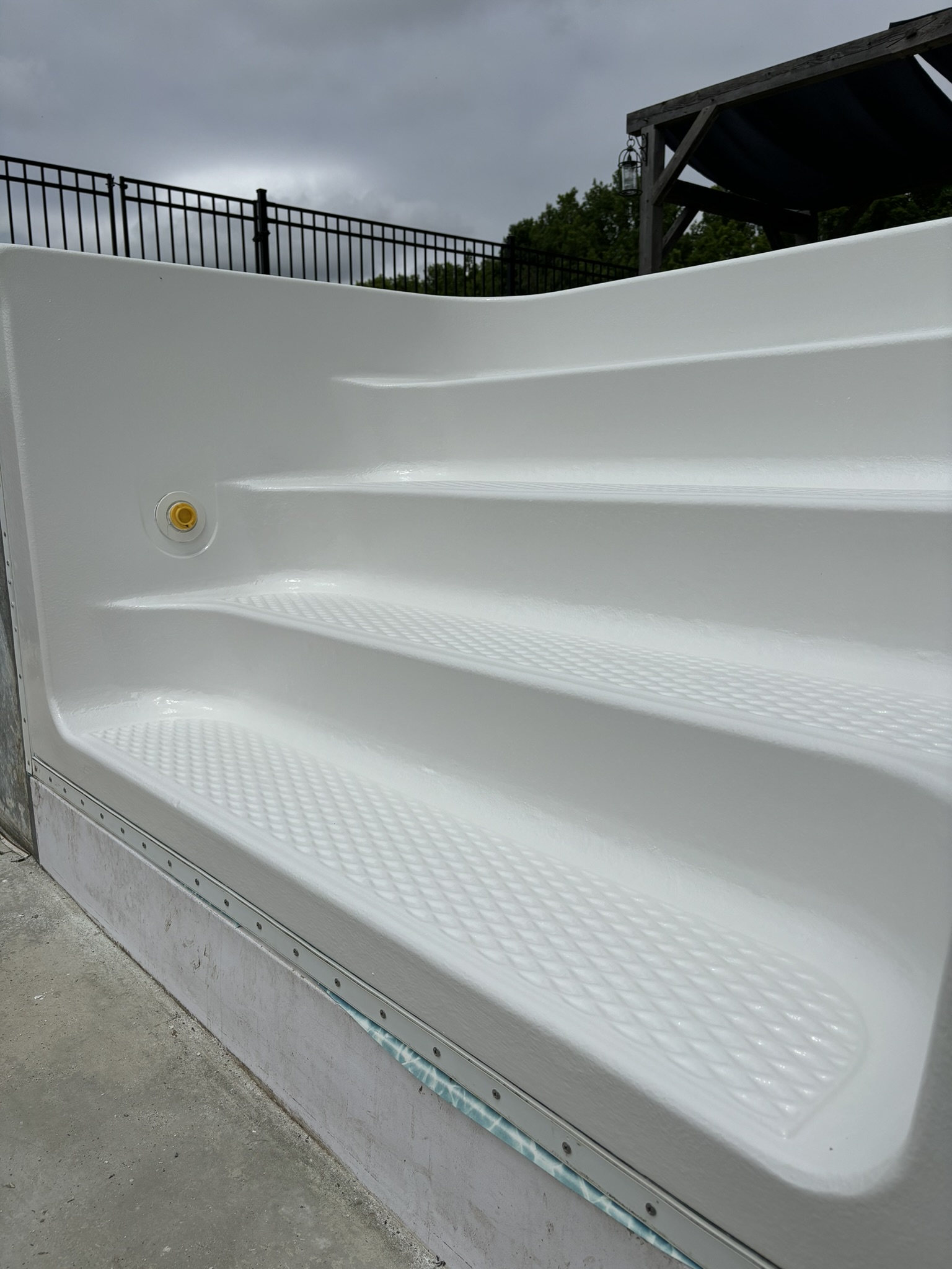Drag to compare — residential pool step after