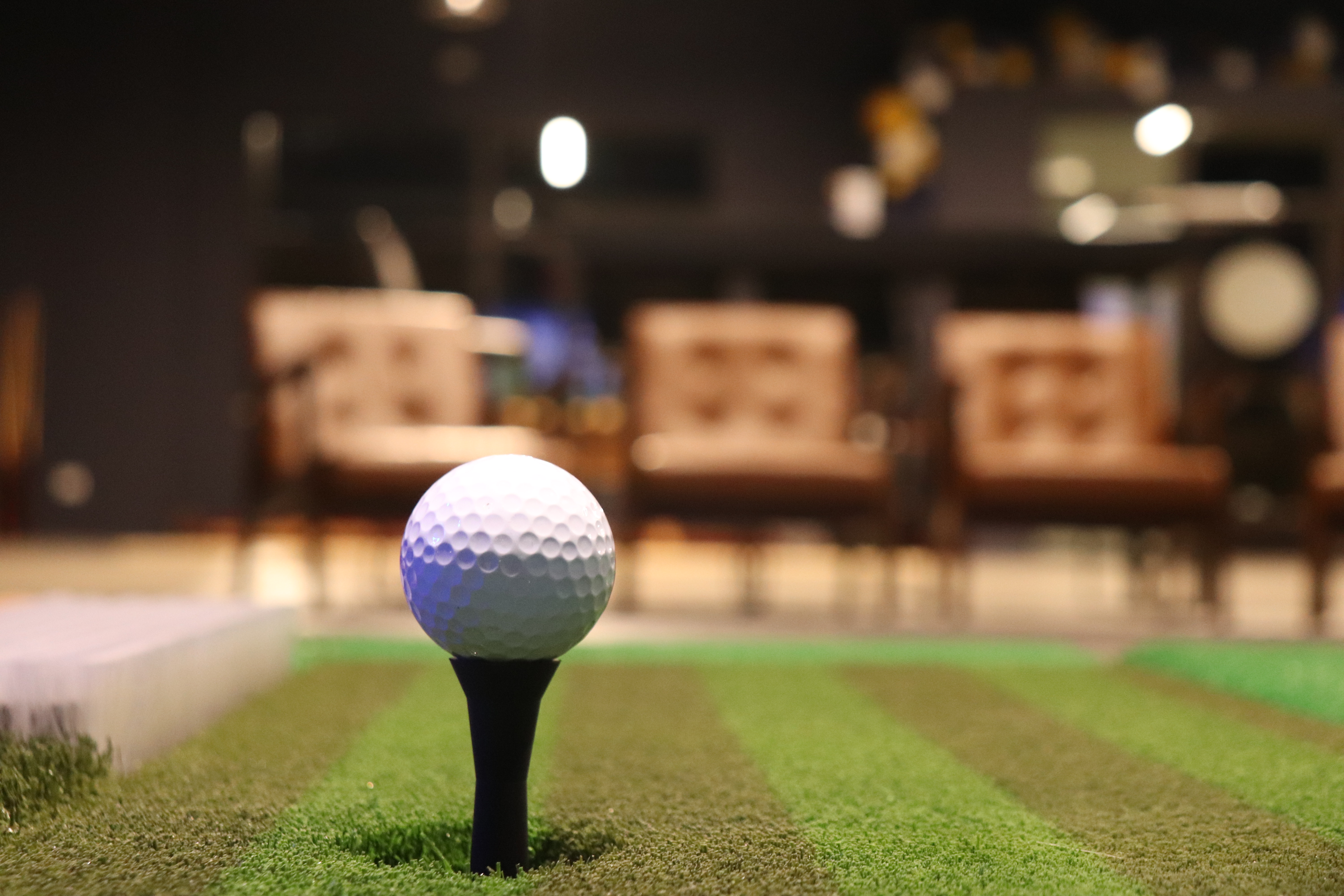 Golf bay at Avid Caddie Golf Lounge in Lone Tree, Colorado