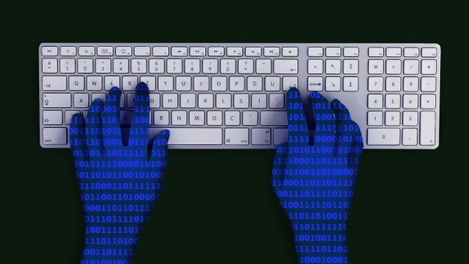 hands typing on computer keyboard