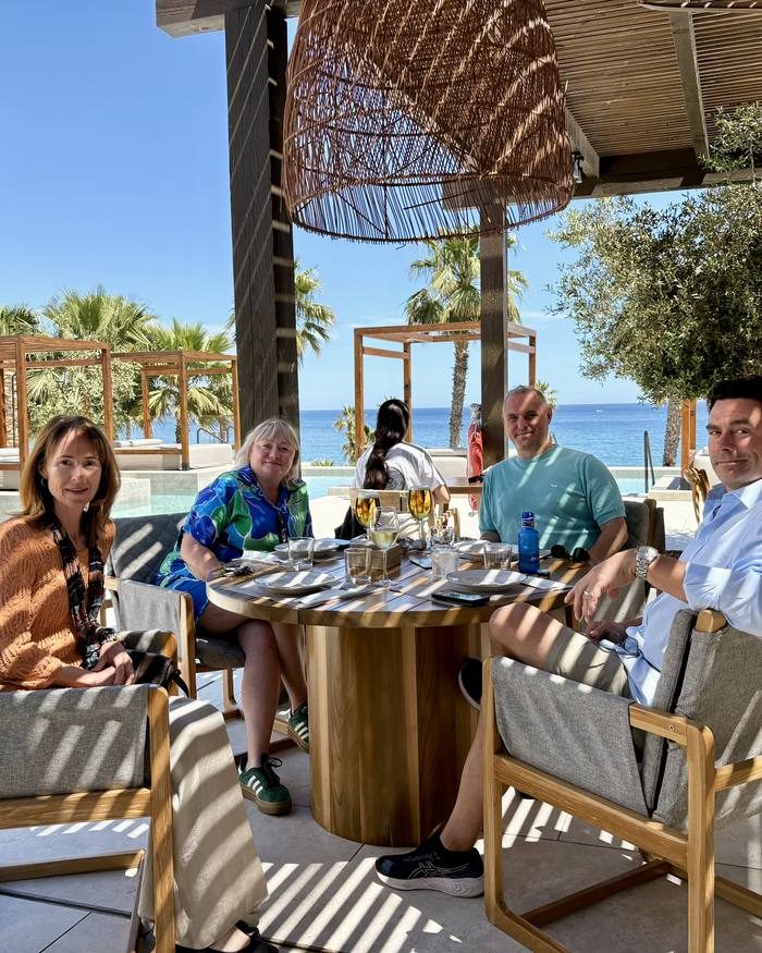 The four founders of Terano at lunch by the sea