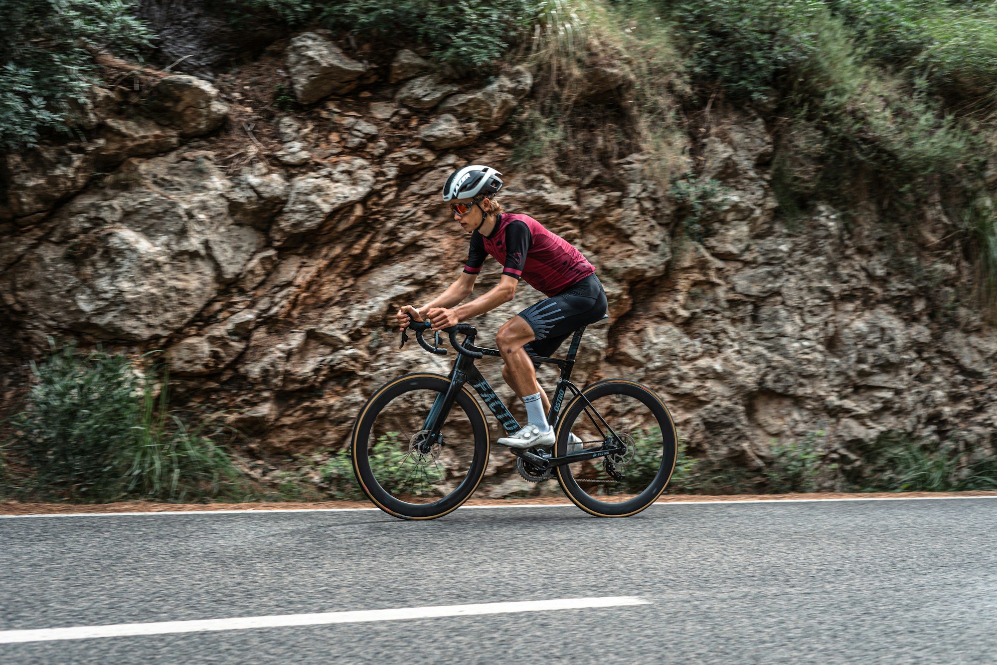 A road cyclist climbing a quiet mountain road