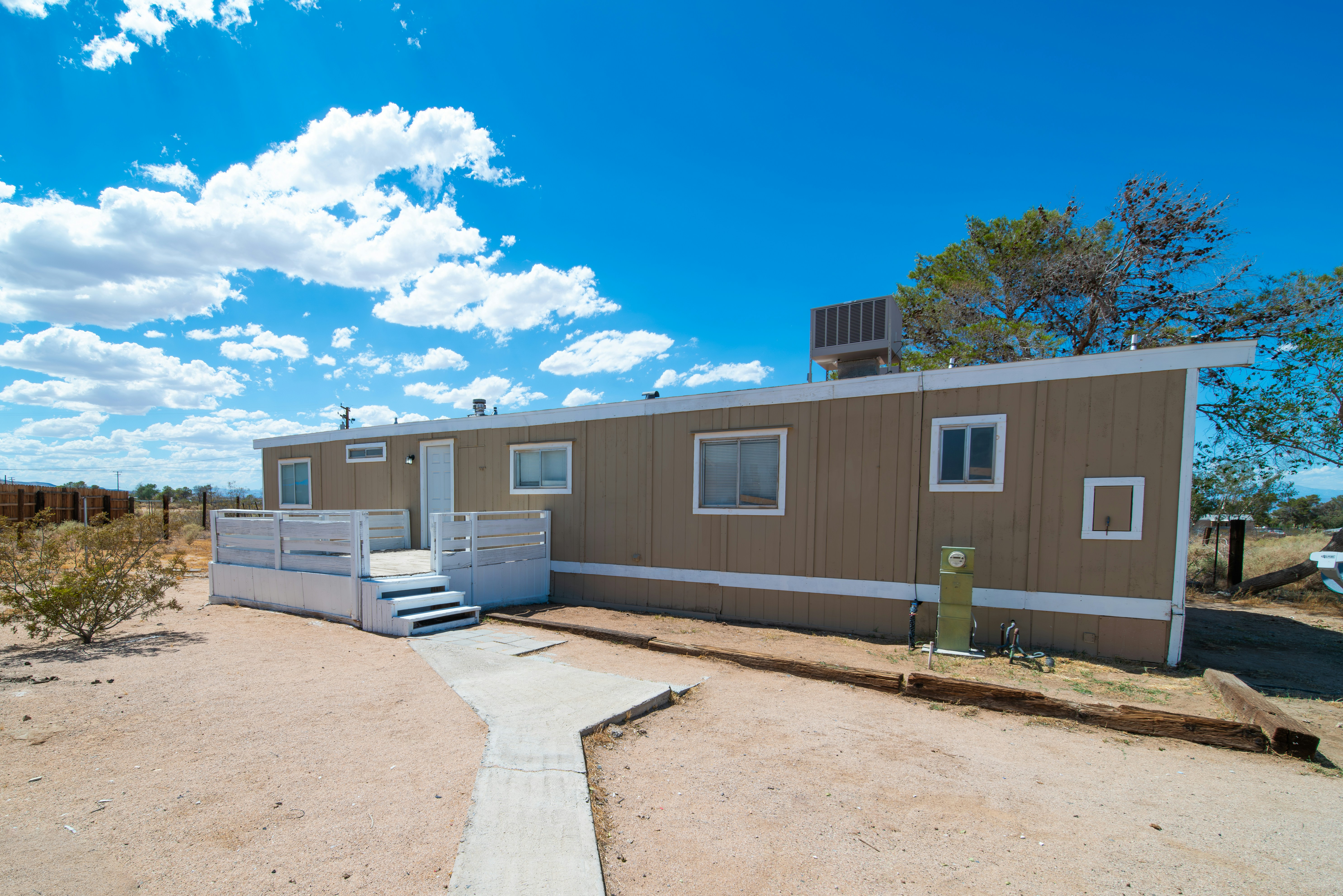 Manufactured home under blue sky