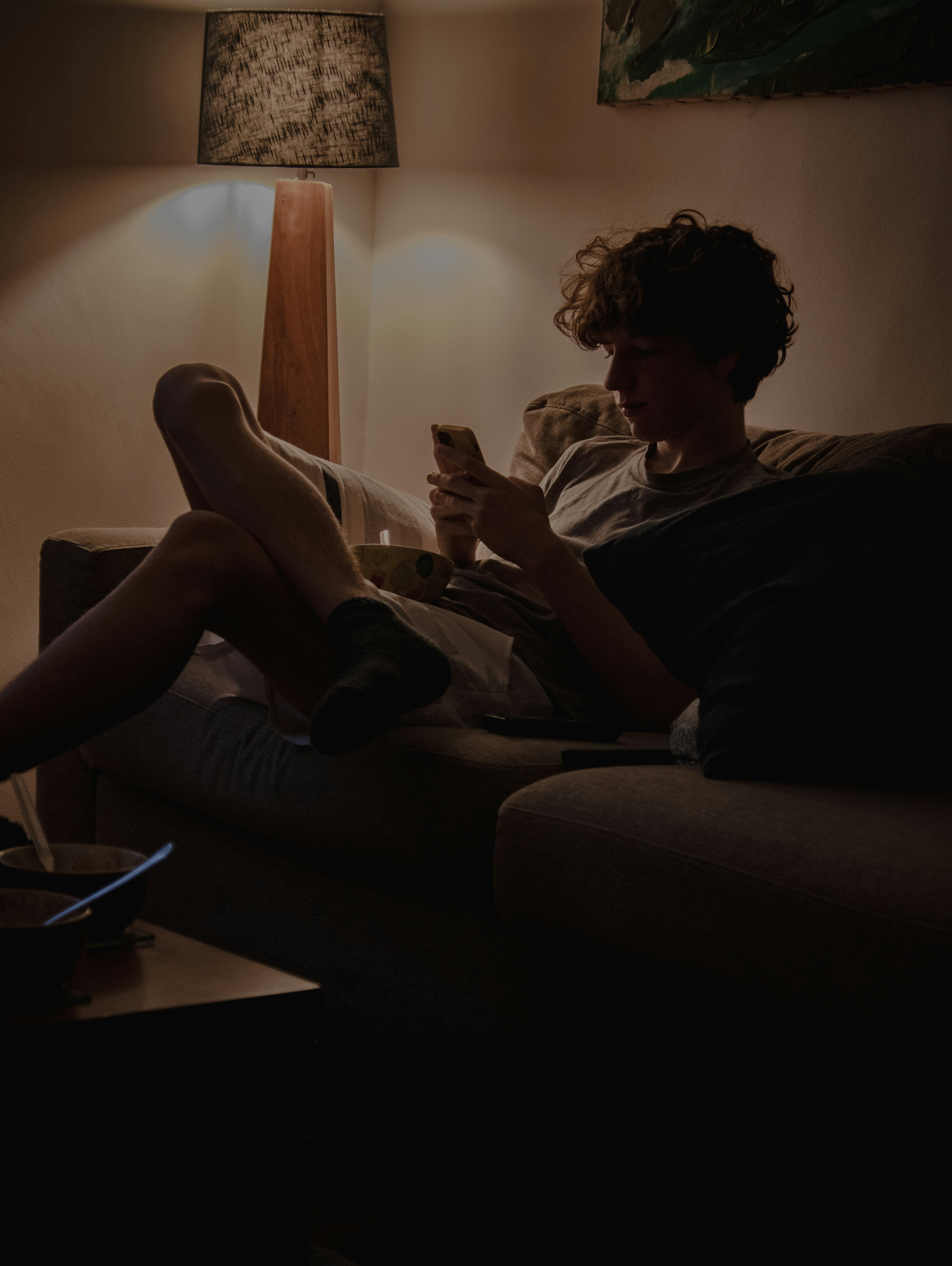 Person texting on phone at night
