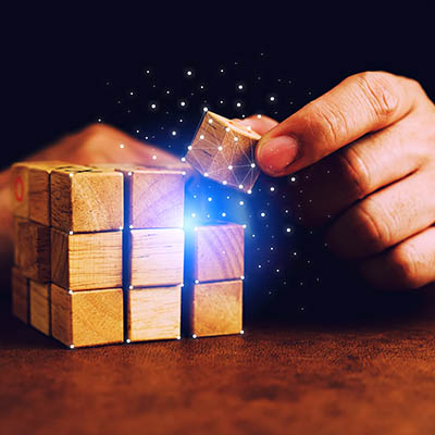 Close up of a business person hands using a digital tablet with futuristic tech icons floating above the screen in a modern office