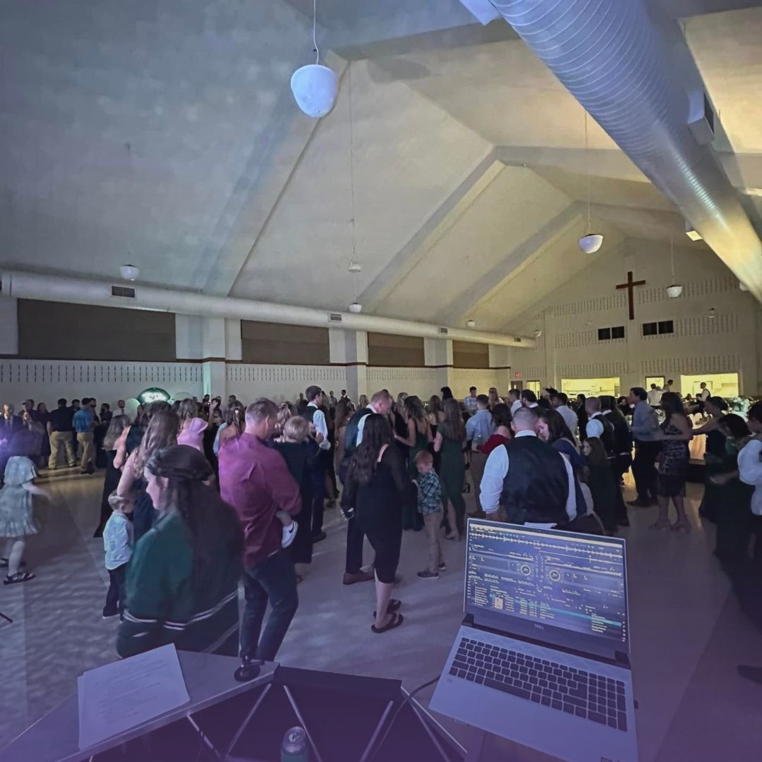 Professional wedding DJ services with dance floor full of guests celebrating