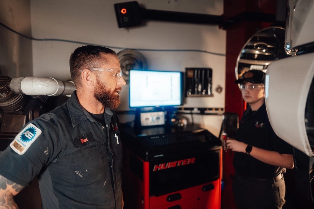 Dan and Gage Sager at the Hunter Engineering alignment machine. Sager & Sons Auto, Boise, ID