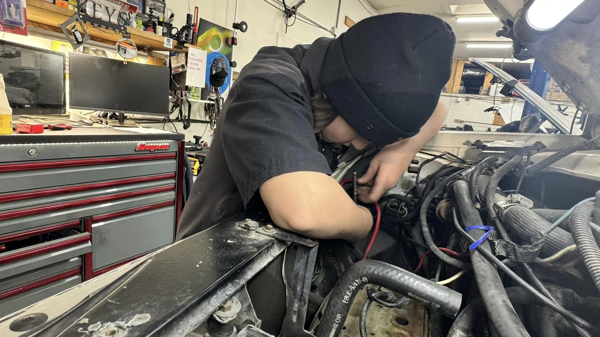 ASE-certified technician performing vehicle diagnostics at Sager & Sons Auto in Boise, ID