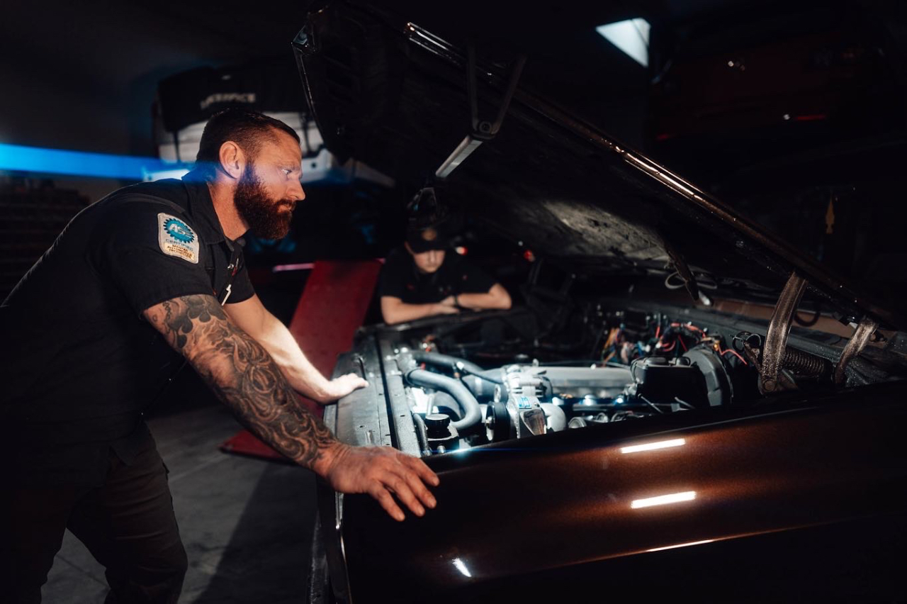 Dan Sager, ASE Master Technician, performing diagnostic engine work at Sager & Sons Auto in Boise, ID