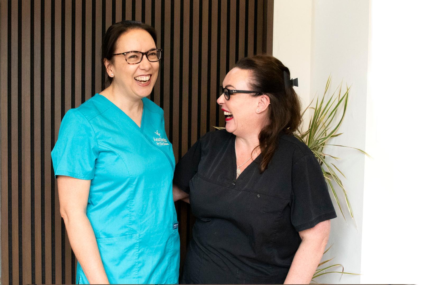 Dr Emma Castro sharing a laugh with the team at The Treatment Rooms Essex, Braintree