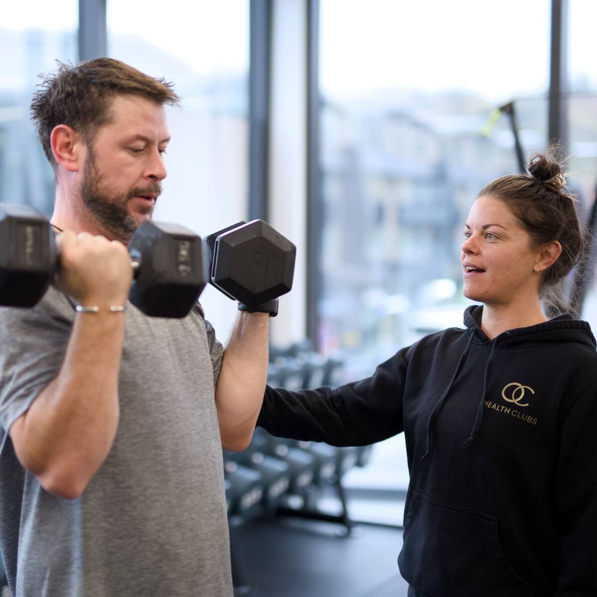 An OC coach assessing a member's movement in Queenstown