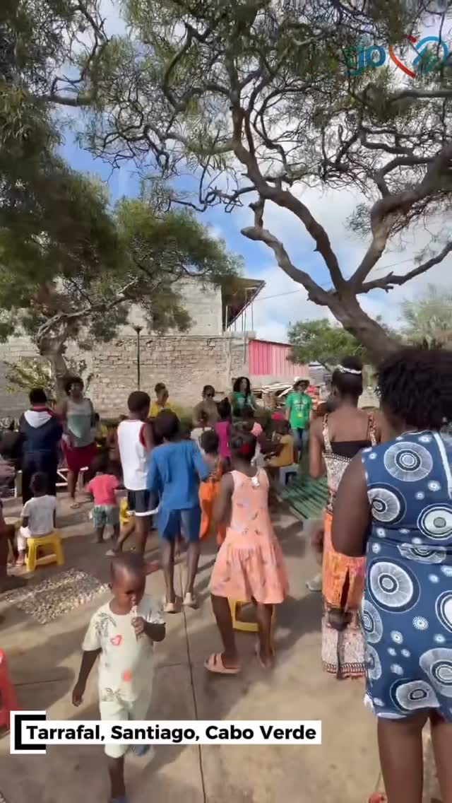 Project Go team gathered with families under a tree in Cape Verde in 2026