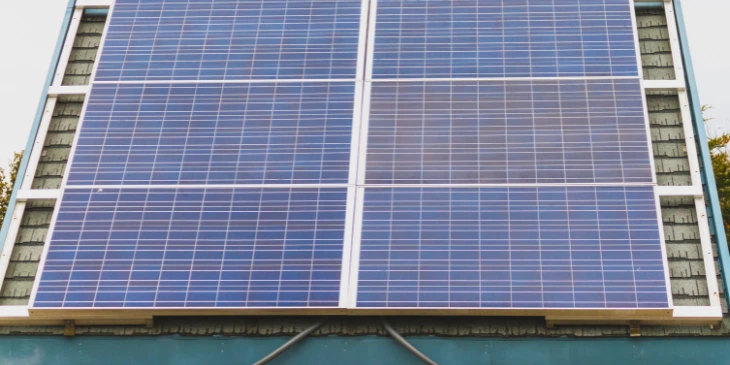 Solar panels installed on a shed wall