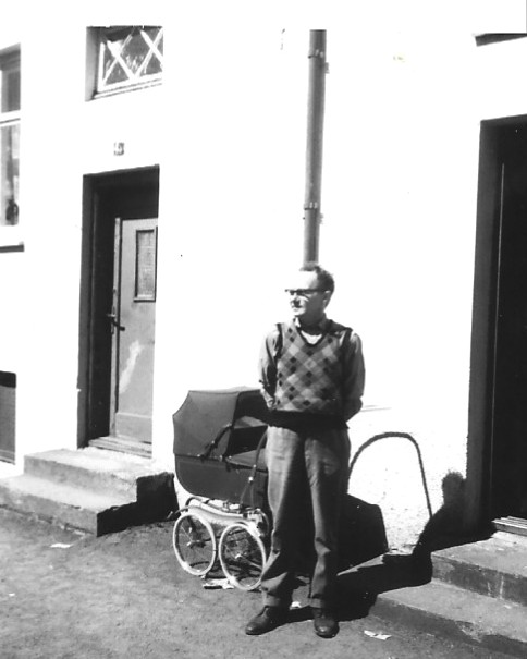 His grandfather in front of the childhood home