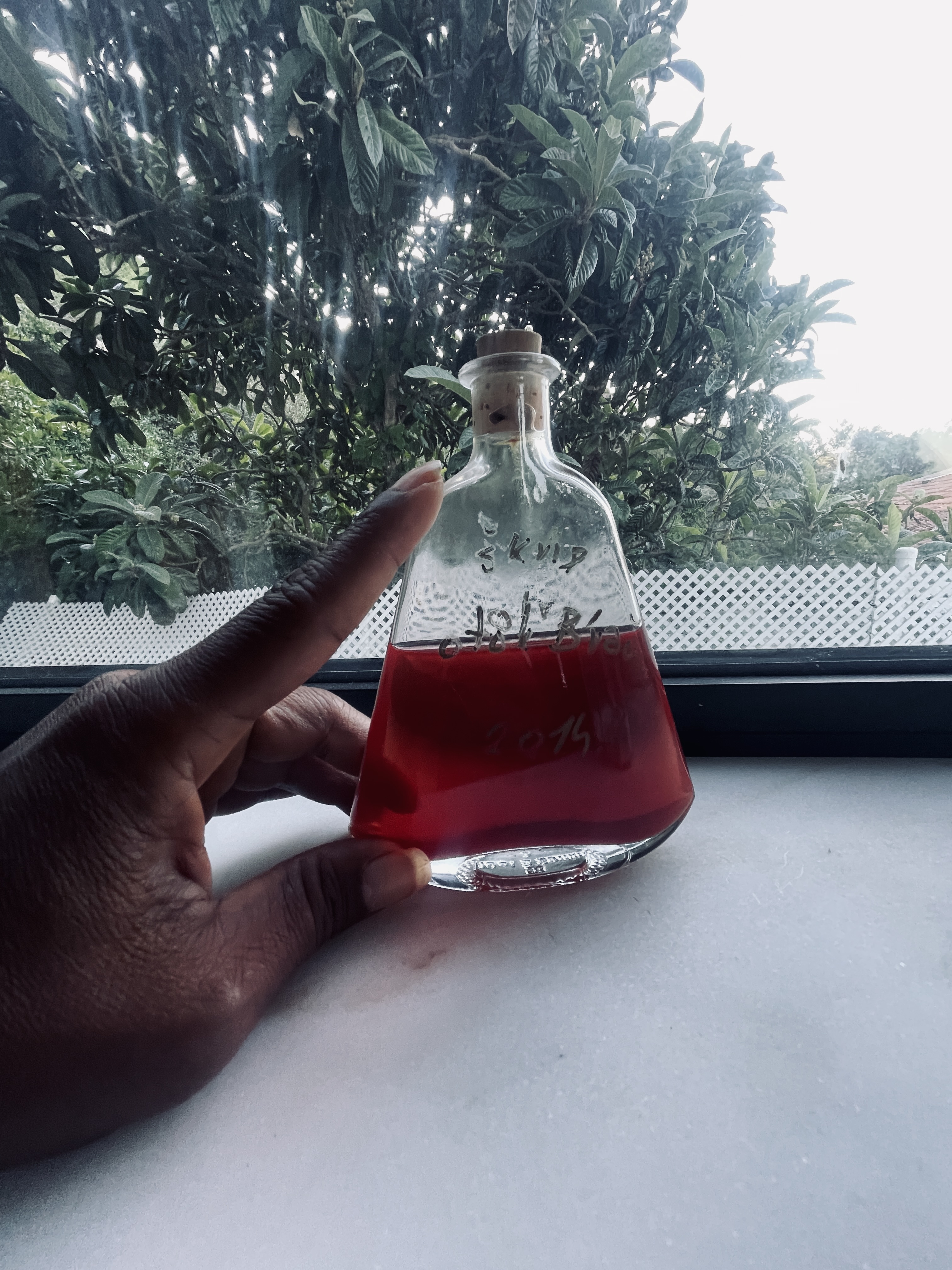 A bottle with pink liquid