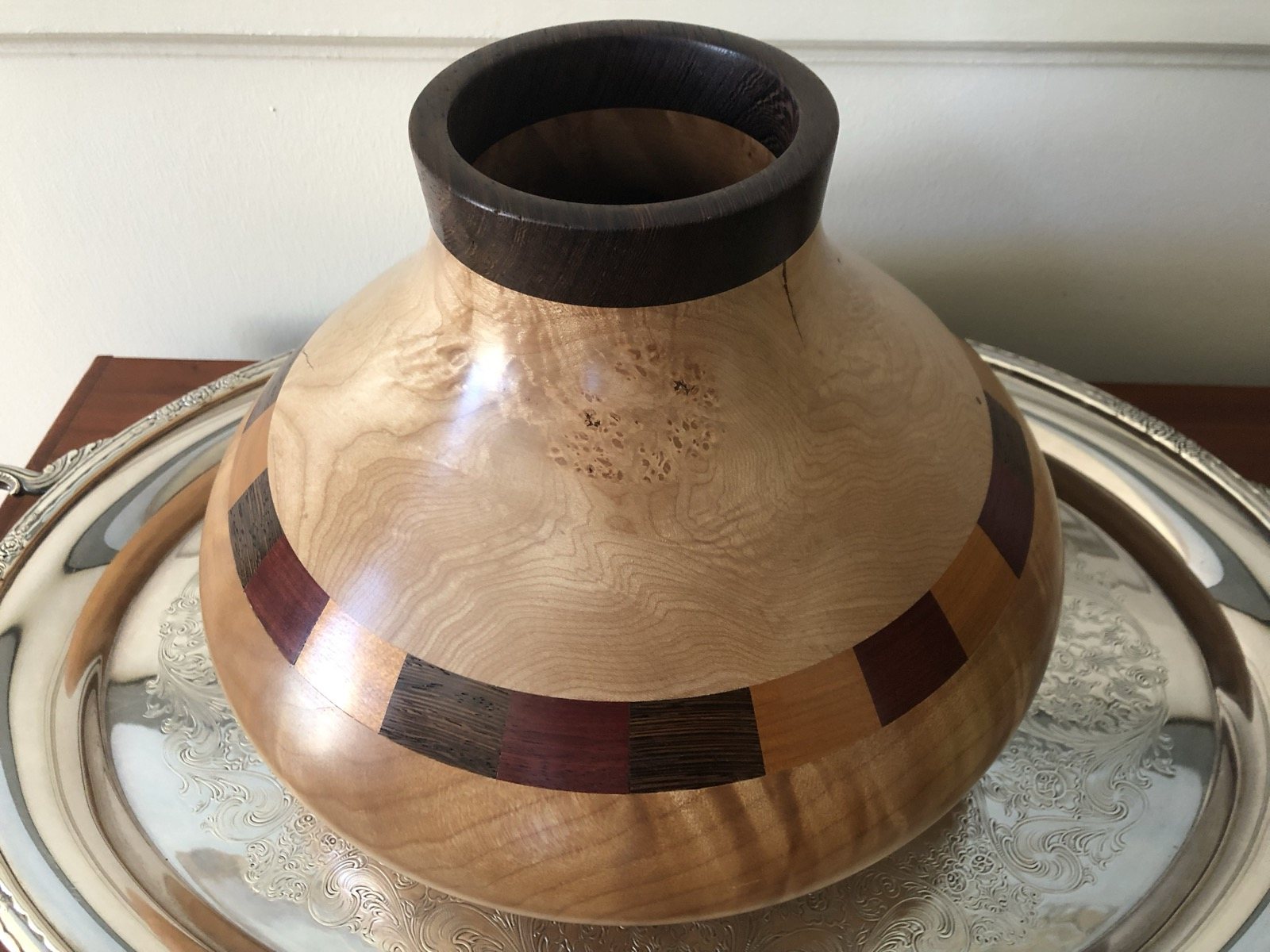 Rounded turned wood vessel with contrasting dark bands