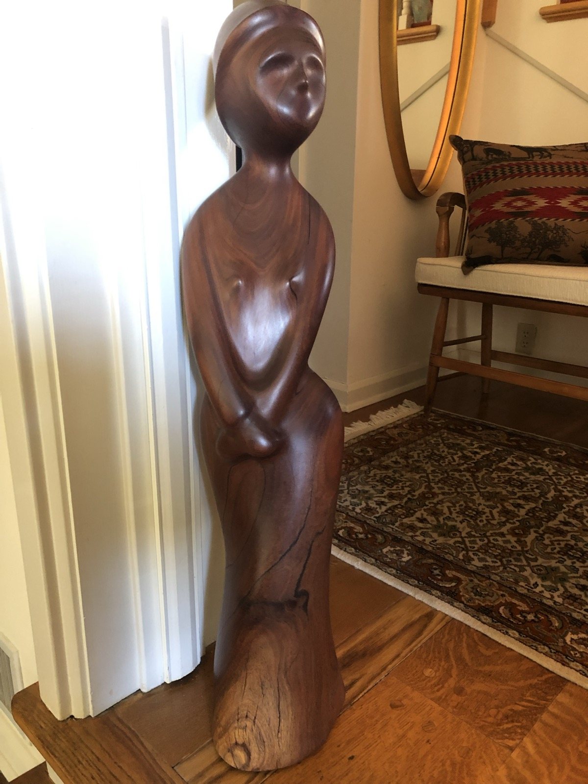 Alternate view of the reclining wood sculpture