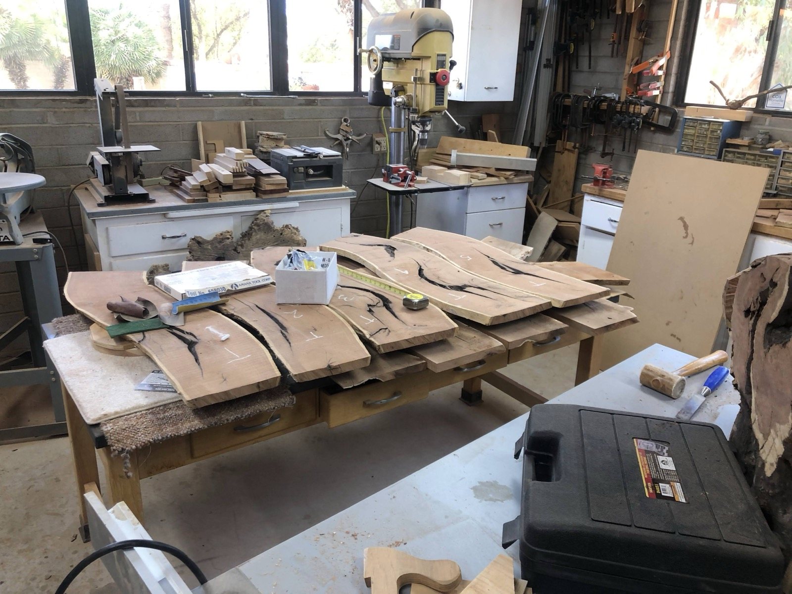 Workshop bench with wood pieces and tools