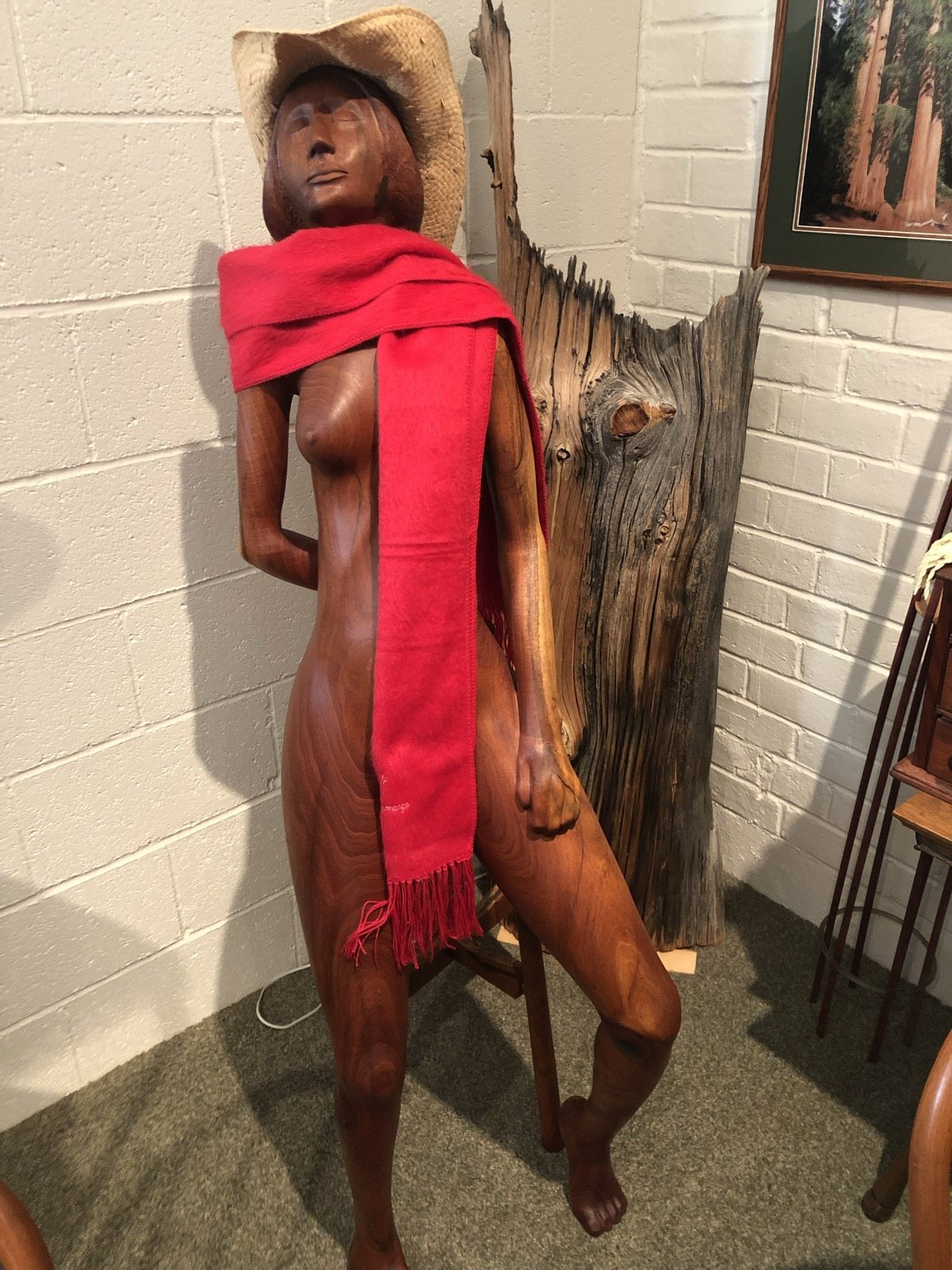Large wood figure displayed in the studio