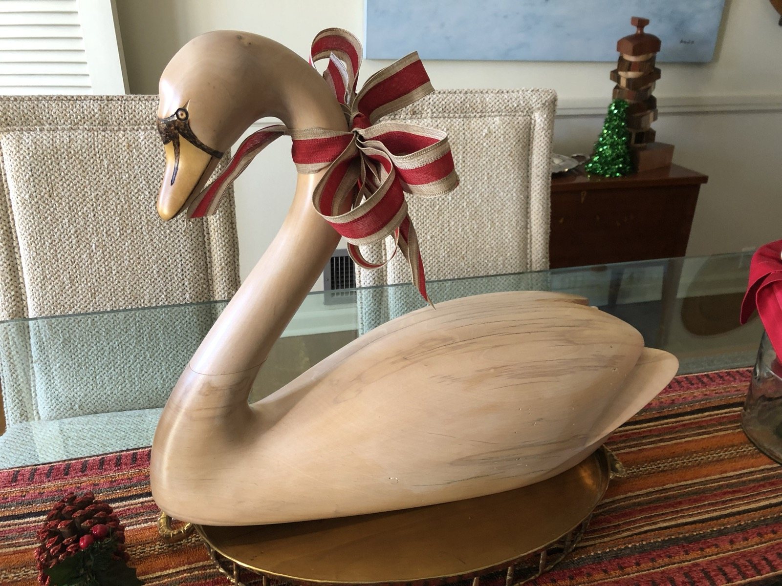 Carved wooden swan with a curved neck
