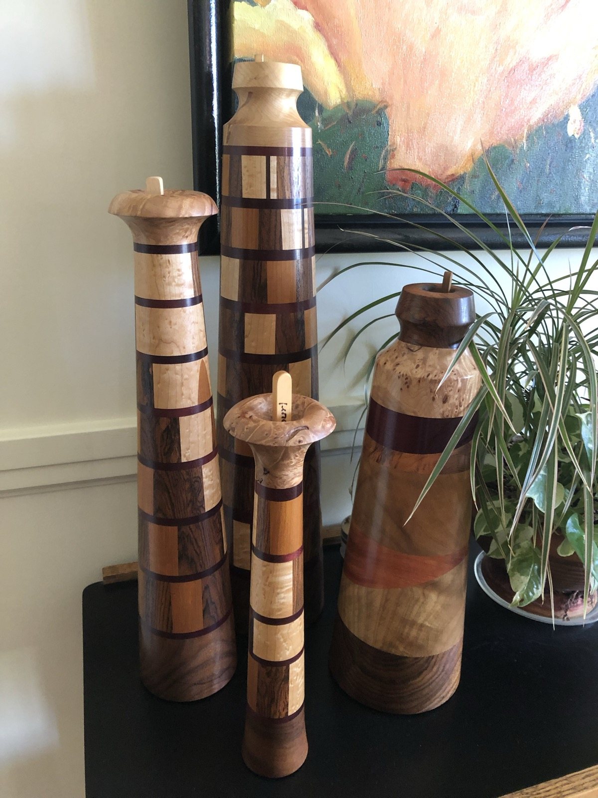 Contrasting segmented wooden forms displayed together