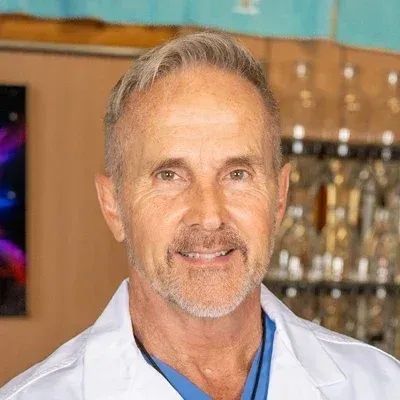 rose gold iPhone 6s on book near Apple watch