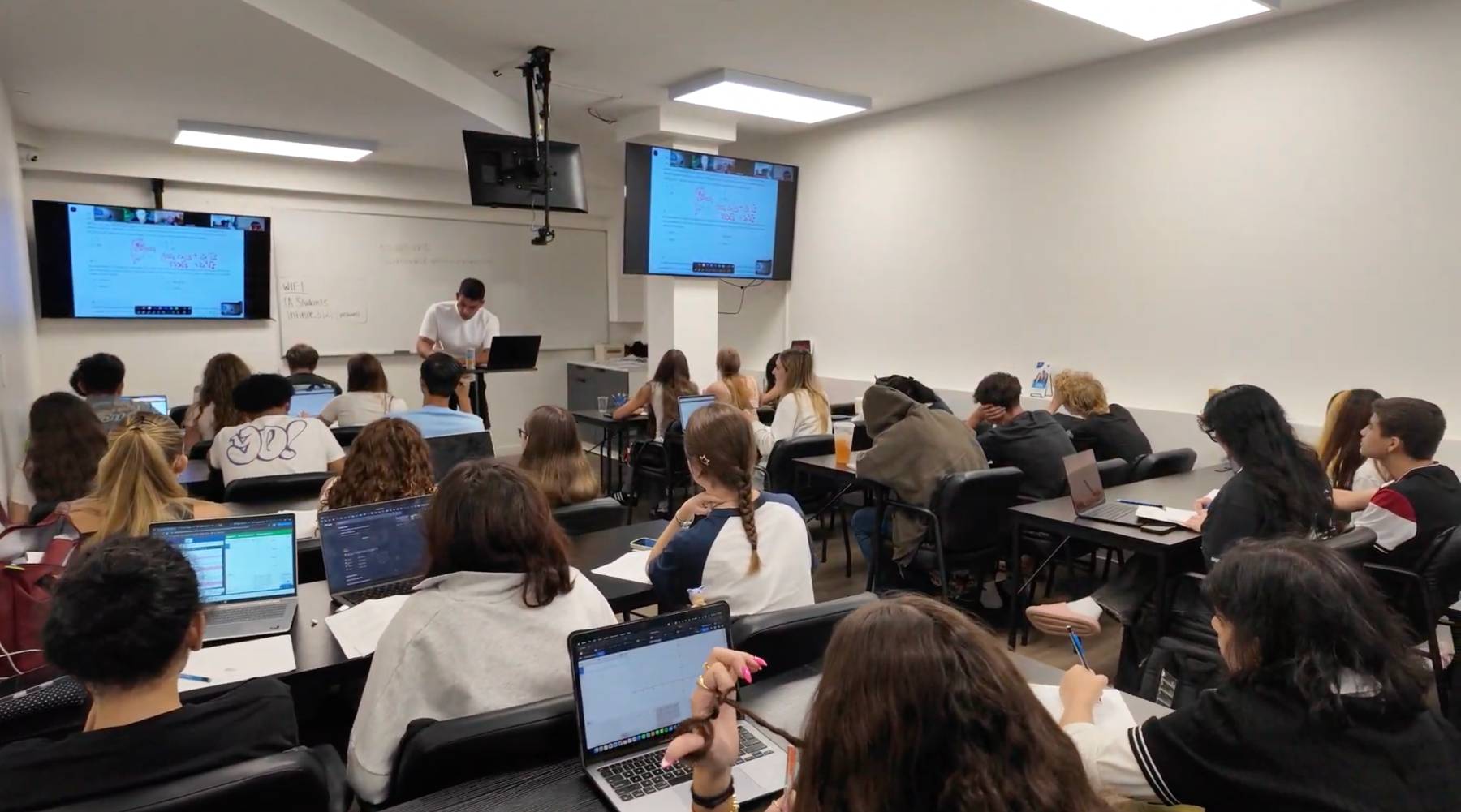 Students learning together in a full class at Infinite Academics in Brooklyn