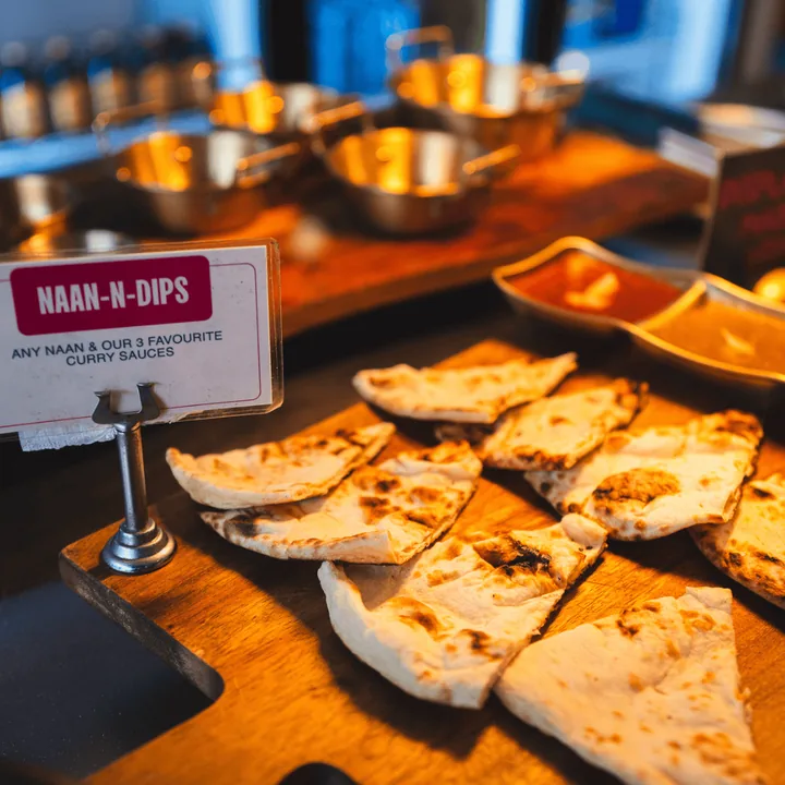 Naan-n-dips counter sign with torn naan