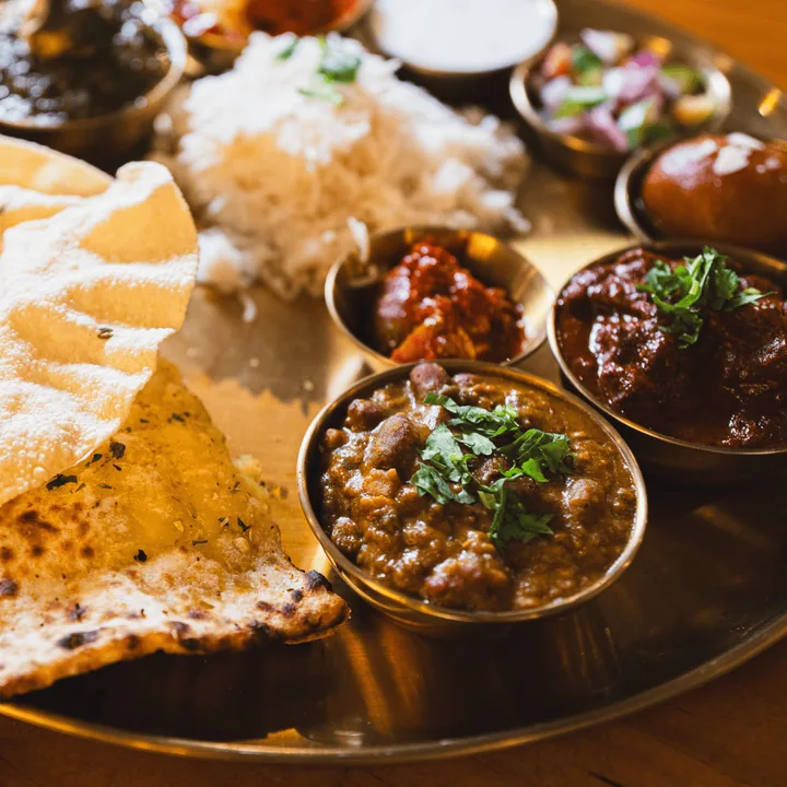 Thali platter with curries, rice and naan