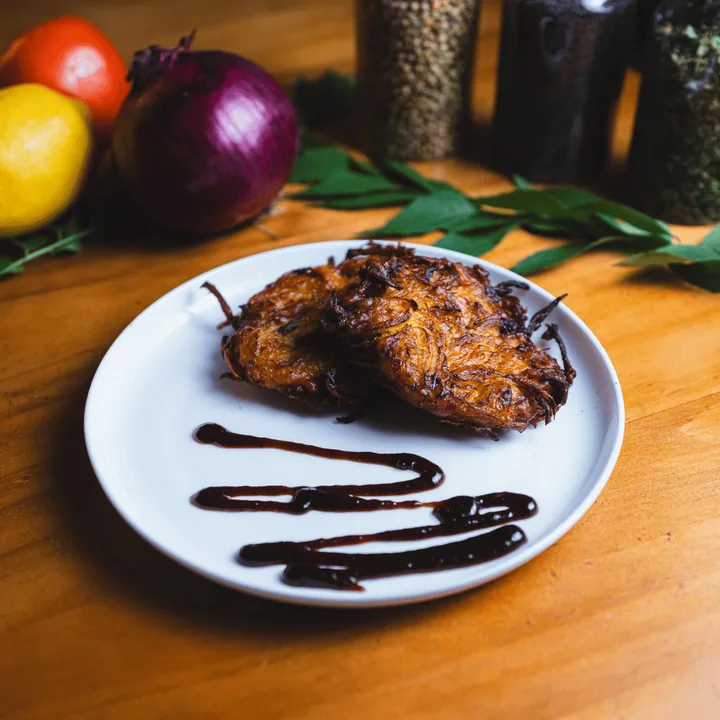 Onion pakora with tamarind drizzle