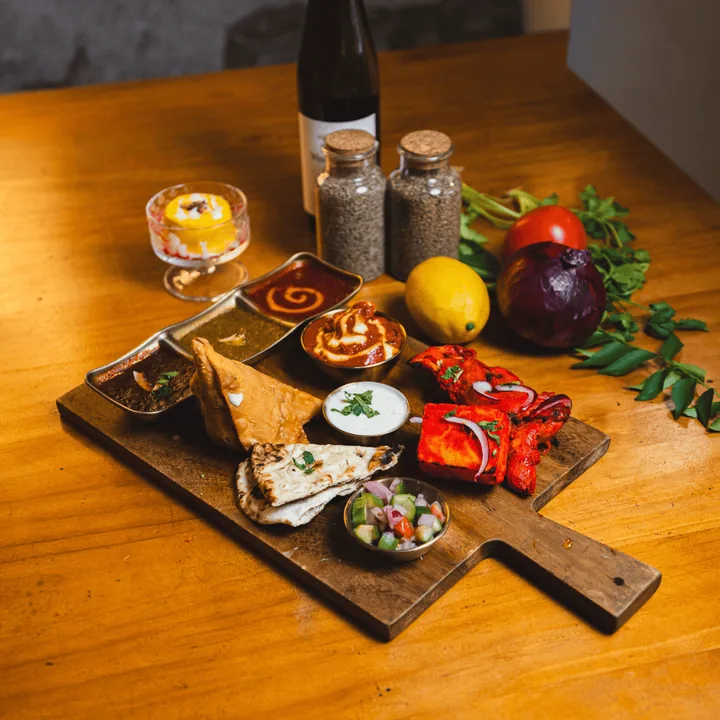 Wooden tasting board with chutneys
