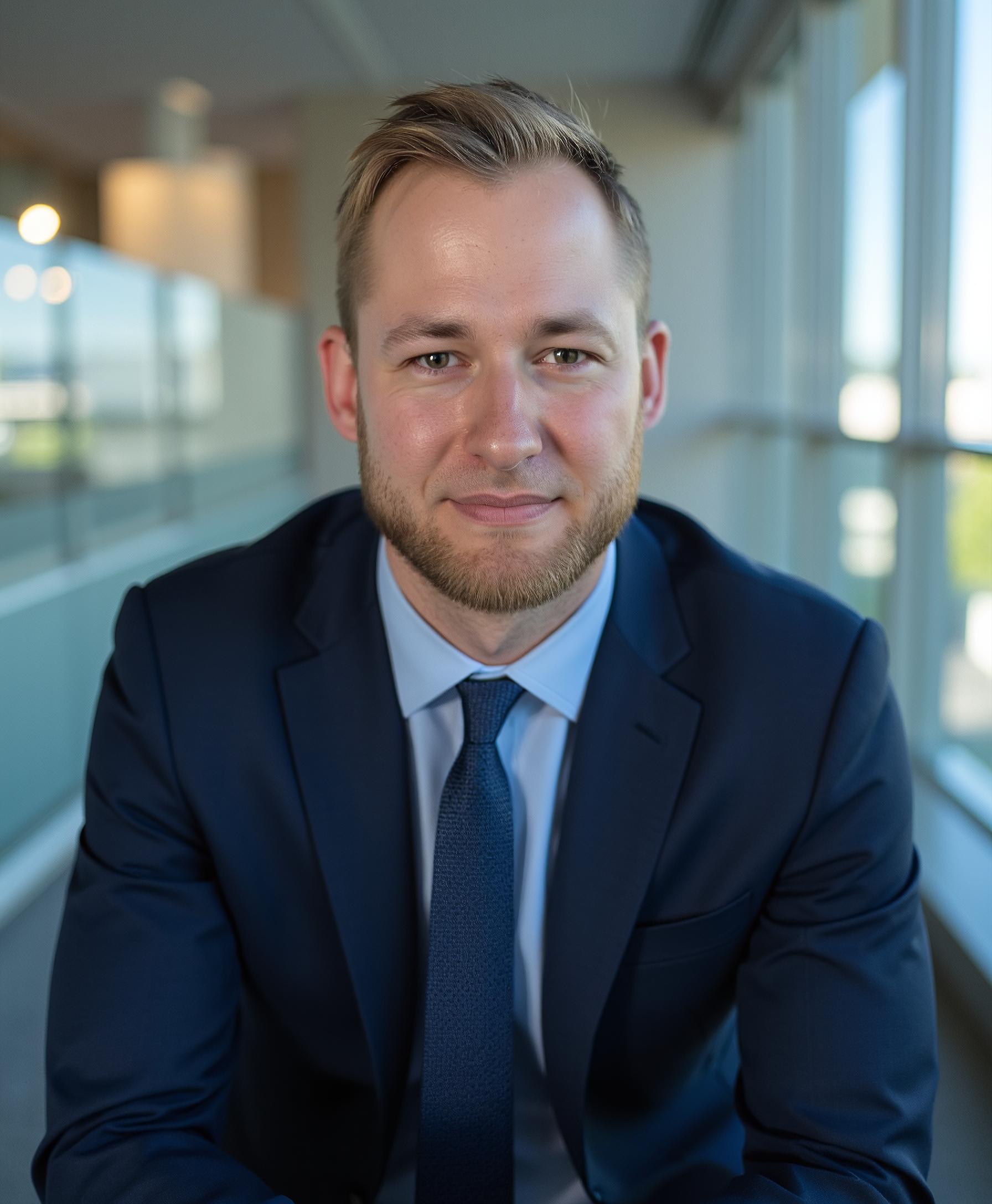 Headshot of Adrian Makowski, founder of Blueberry AI and an AI automation consultant for entrepreneurs.