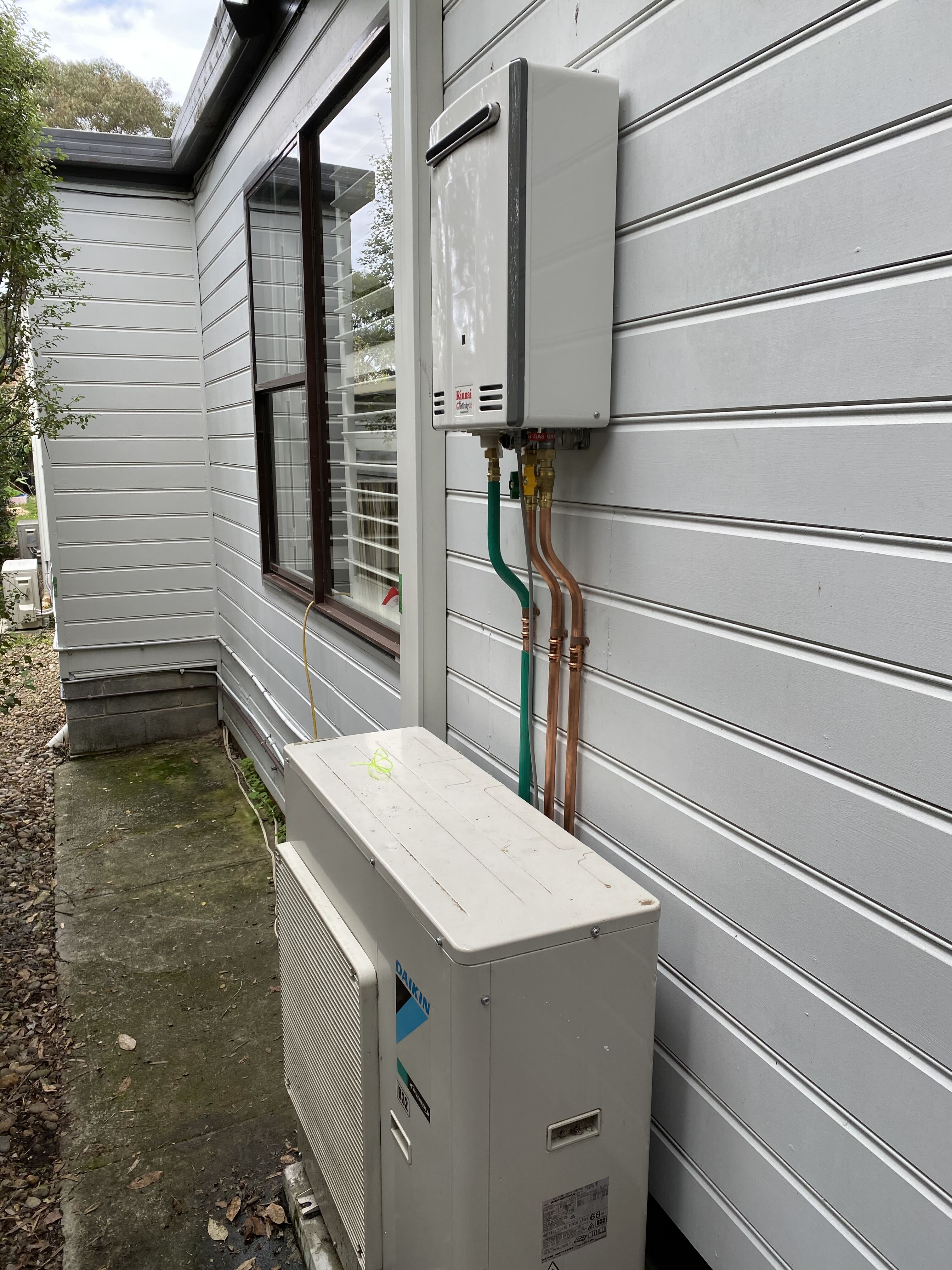 Gas continuous flow unit on weatherboard home