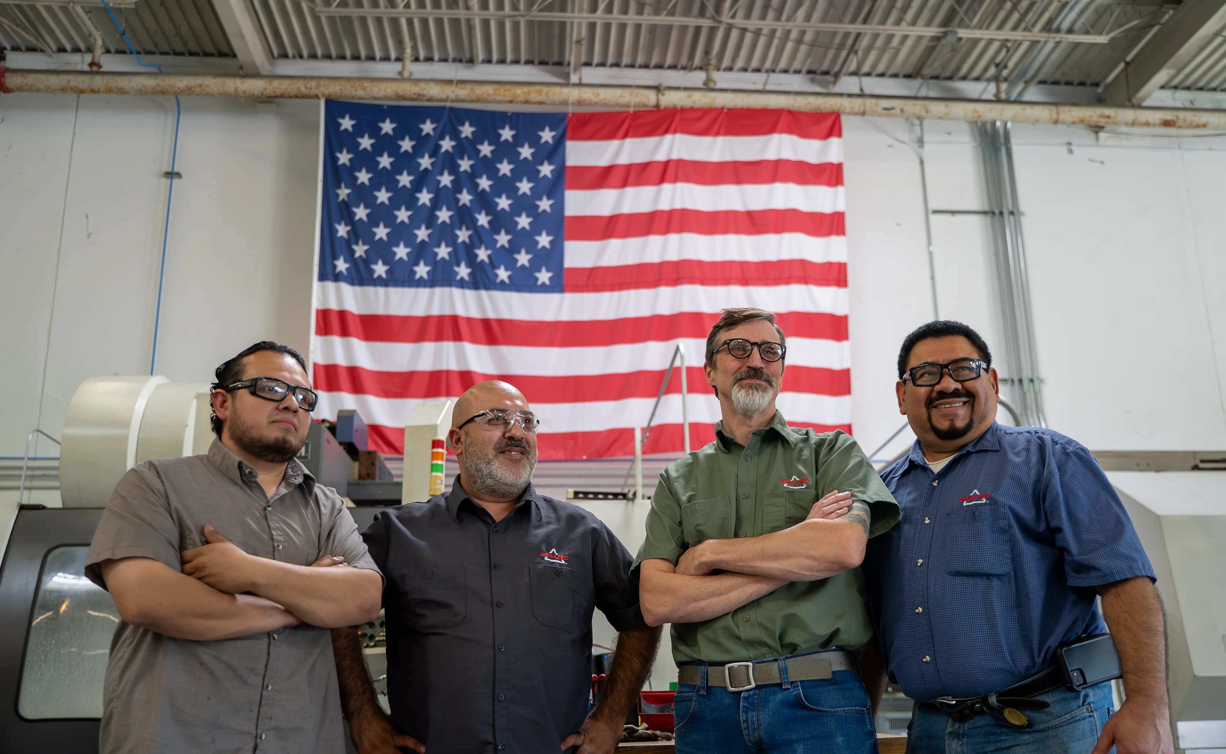 Drilltec industrial team in front of American flag — Houston industrial photography