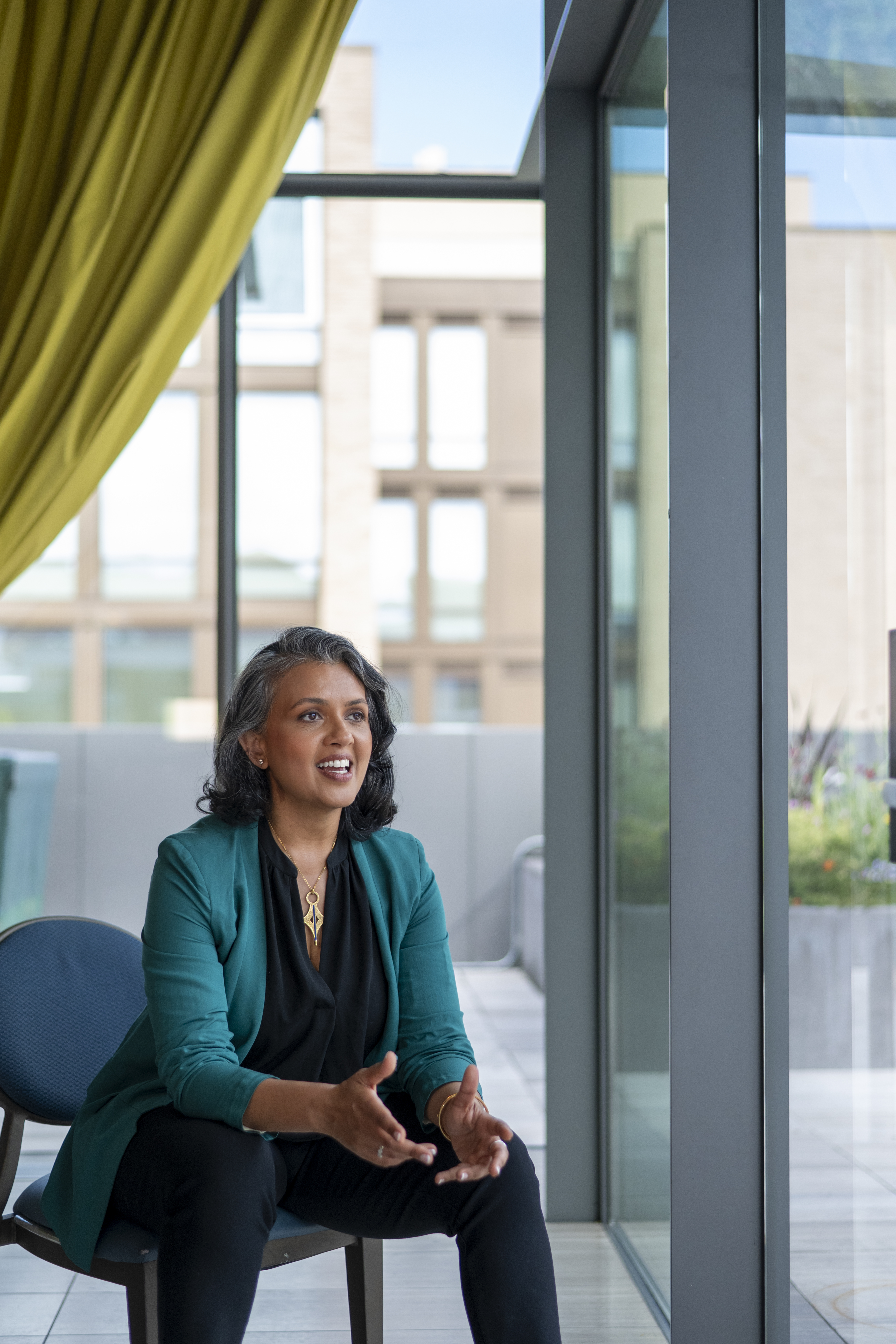 Meghna Majmudar seated in an executive setting