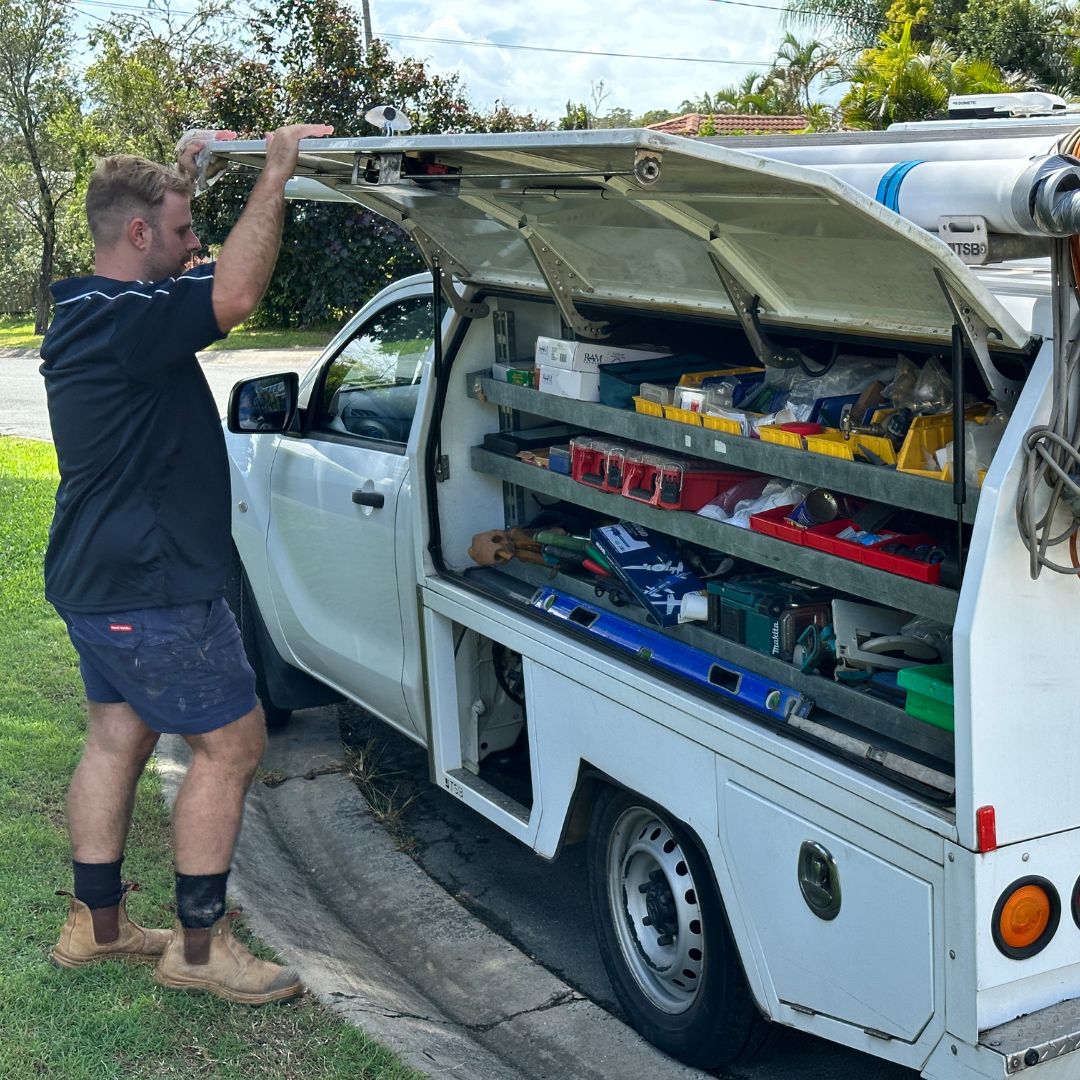 Casey from On The Case Plumbing at the back of his ute