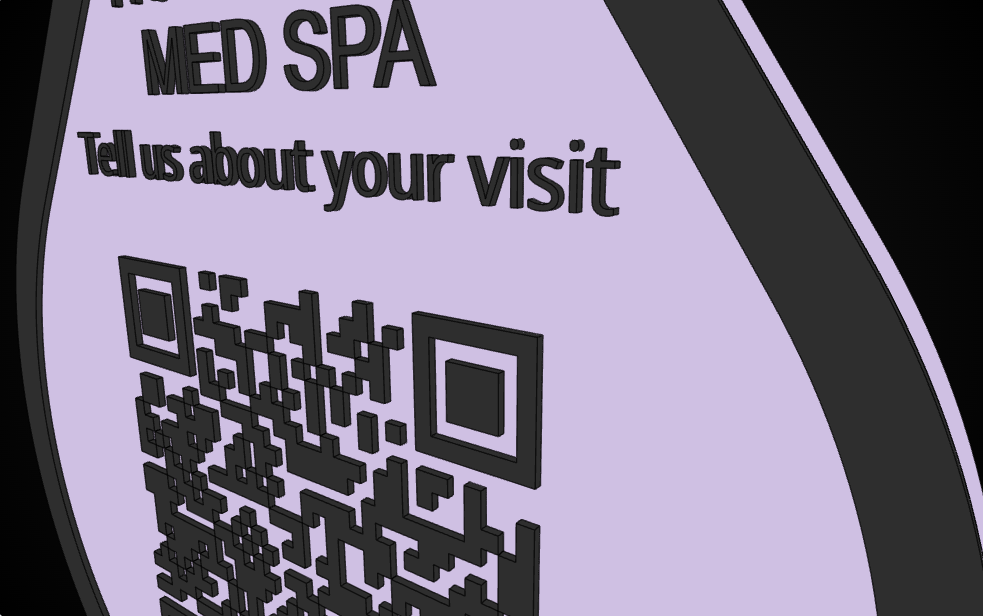 Macro view of the med spa review plaque showing the raised charcoal QR modules and lettering standing above the lavender base plate