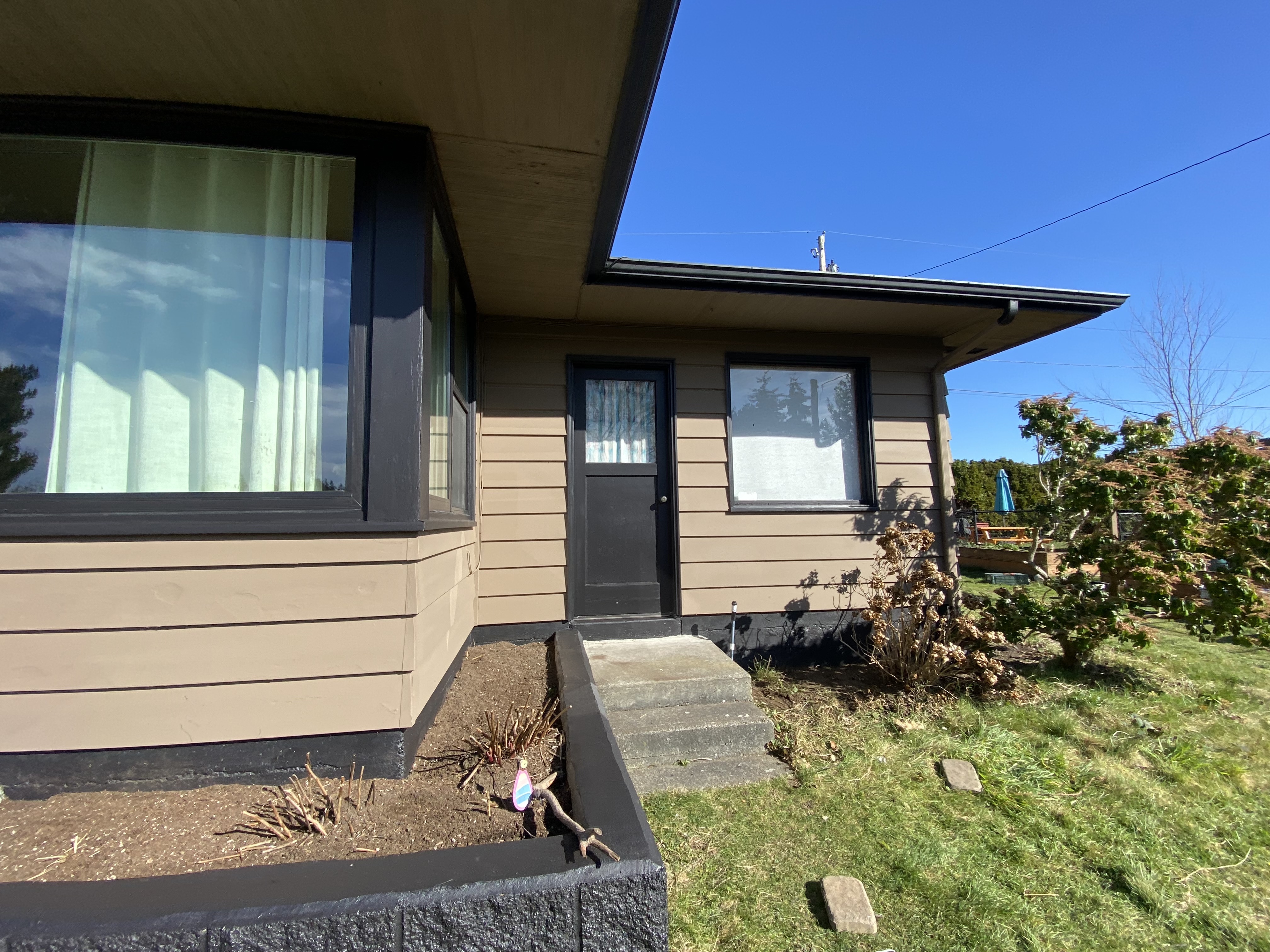 Home painted with black trim and windows