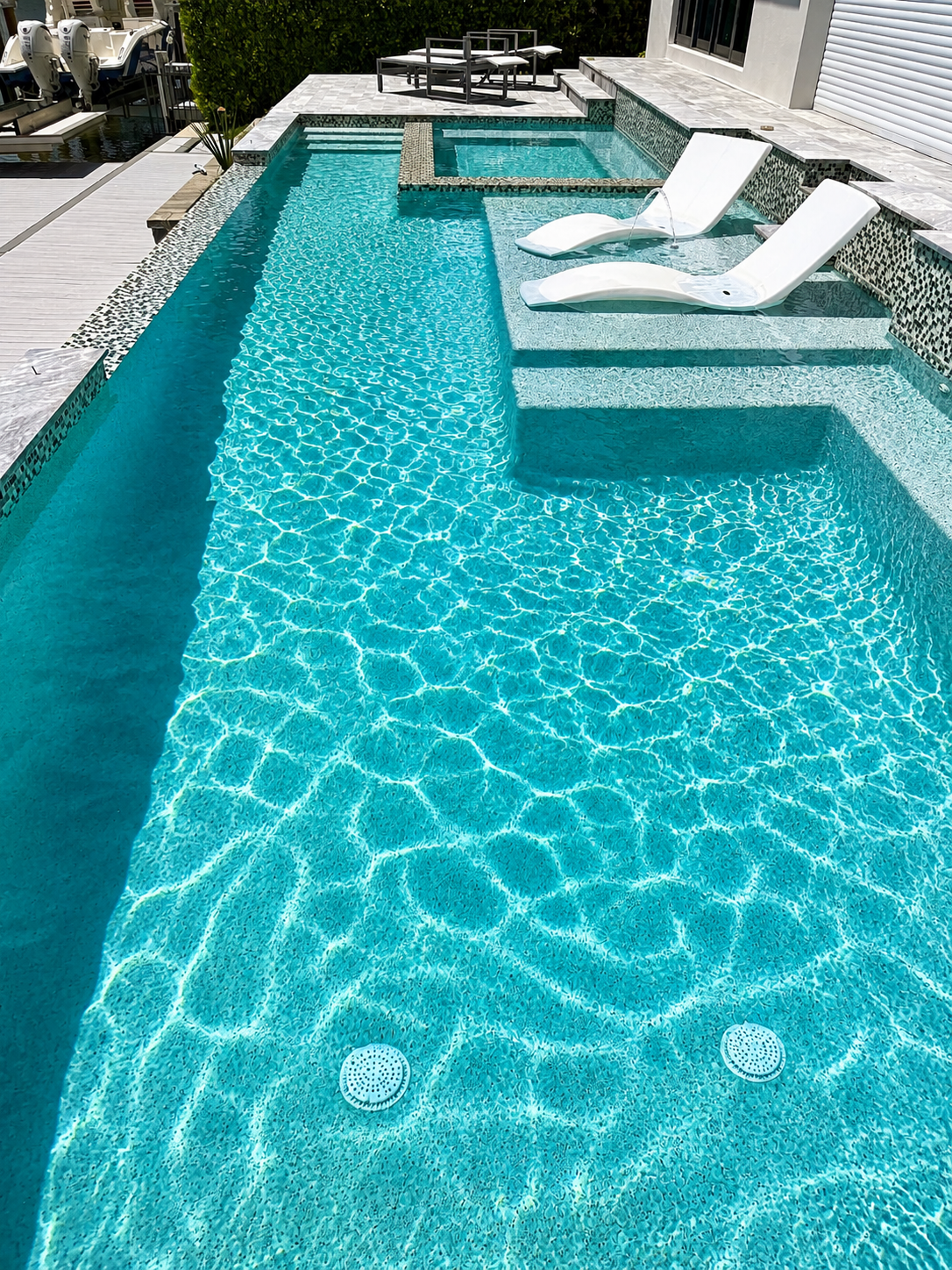 Pool cleaning service in Bonita Springs, FL backyard pool with crystal clear water