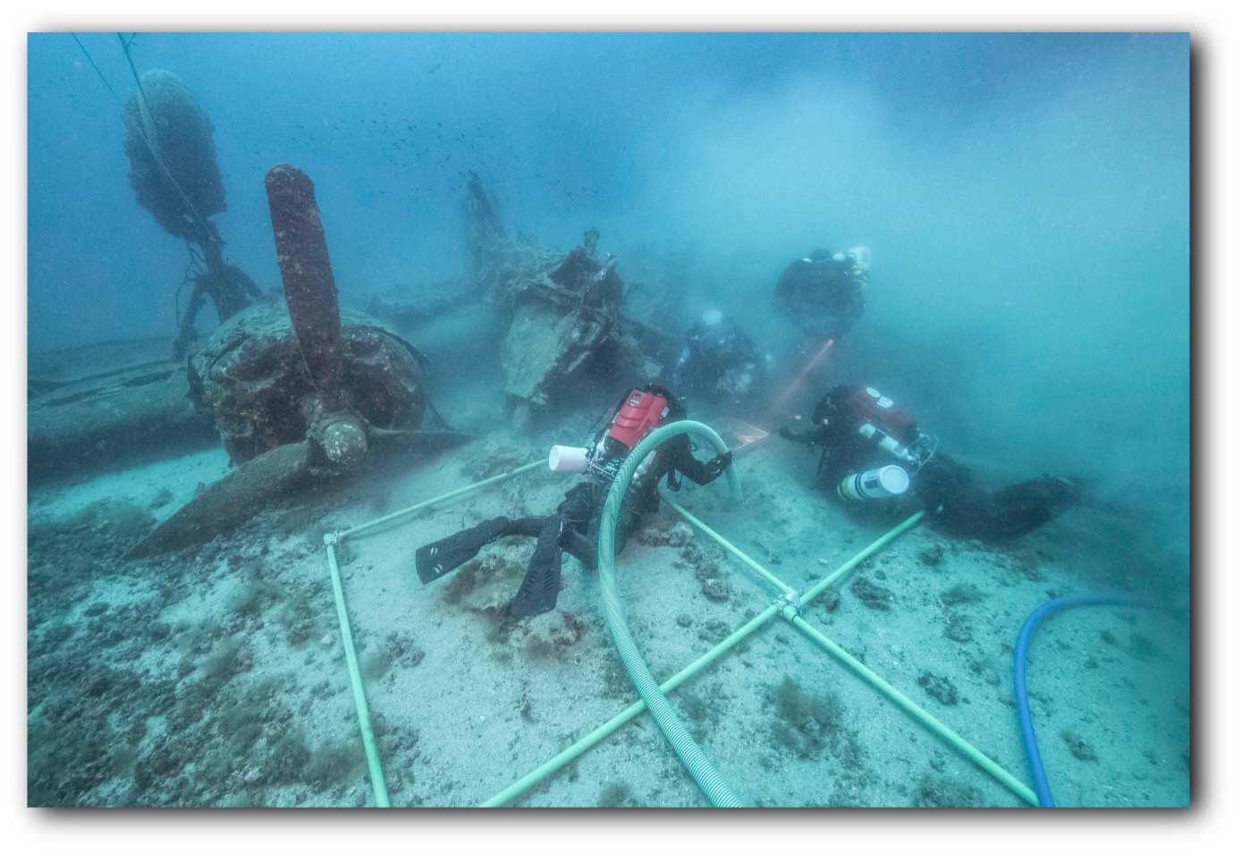 The multinational team at work excavating an area of the Tulsamerican thought to contain remains of the three missing crew. The multinational team at work excavating an area of the Tulsamerican thought to contain remains of the three missing crew.